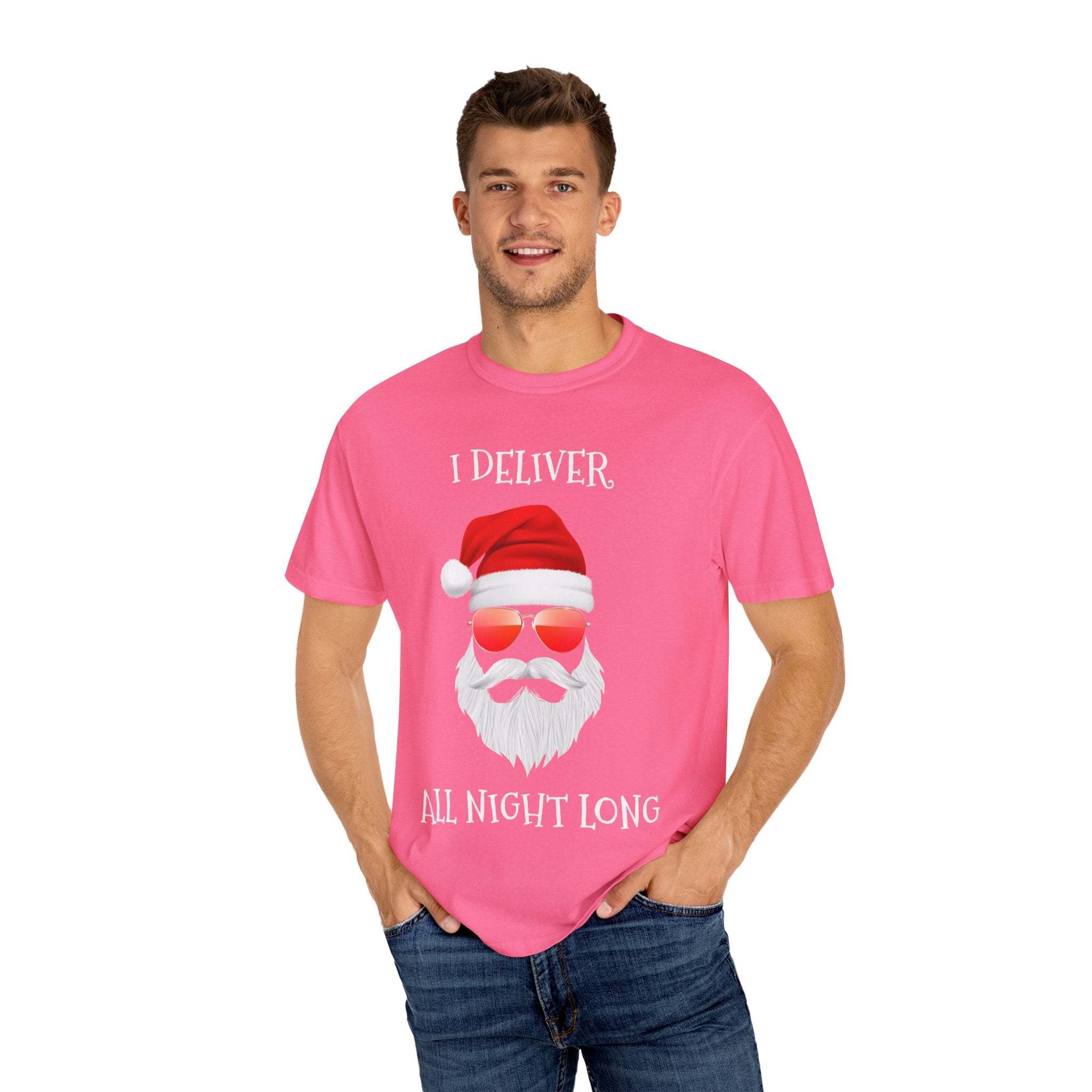 Man wearing pink Santa I Deliver All Night Long Christmas T-shirt with Santa graphic and red sunglasses