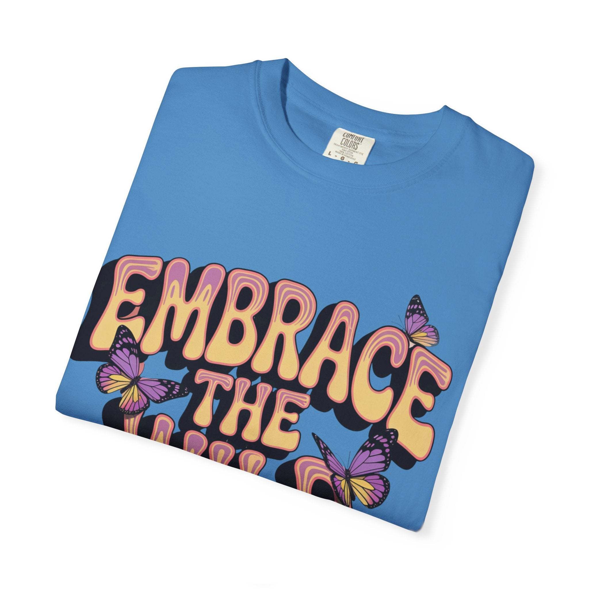 Blue garment-dyed T-shirt with "Embrace the Wild Side" print and butterfly design, made of 100% ring-spun US cotton.