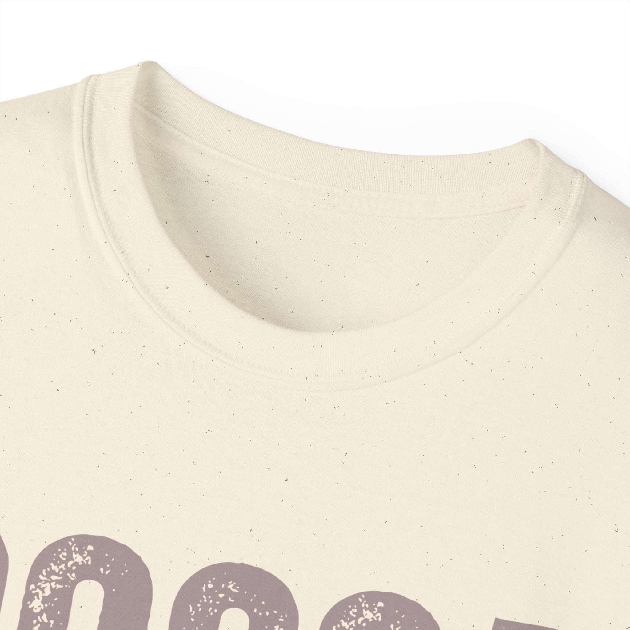 Close-up of distressed Cocoa Cutie Tee made from eco-friendly cotton with a vintage feel
