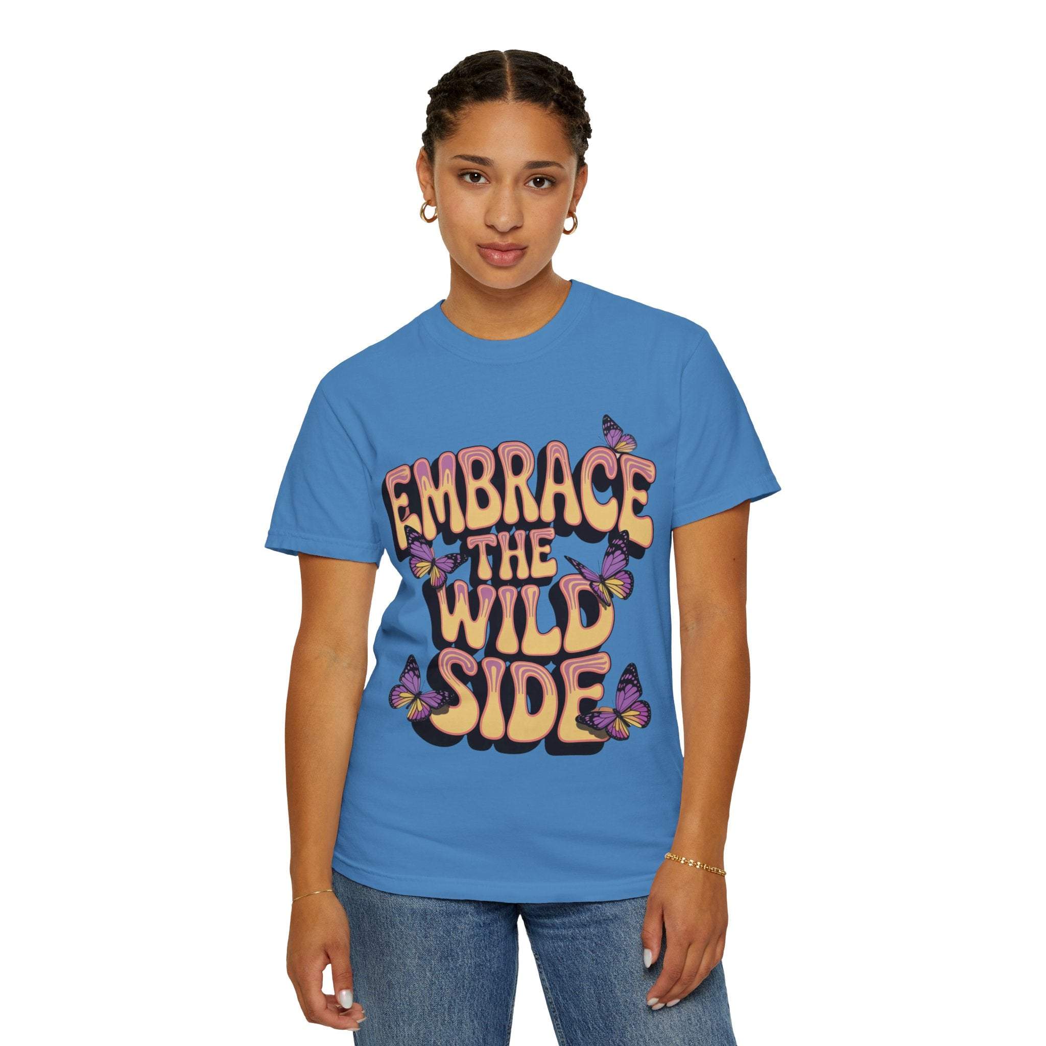 Unisex blue garment-dyed T-shirt with "Embrace the Wild Side" print and butterfly design