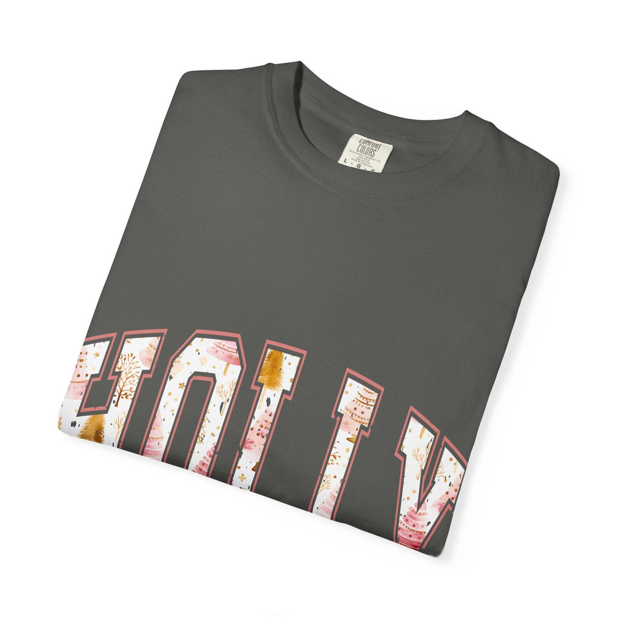 Folded dark gray Varsity Holly Jolly T-shirt with festive lettering and garment-dyed fabric.