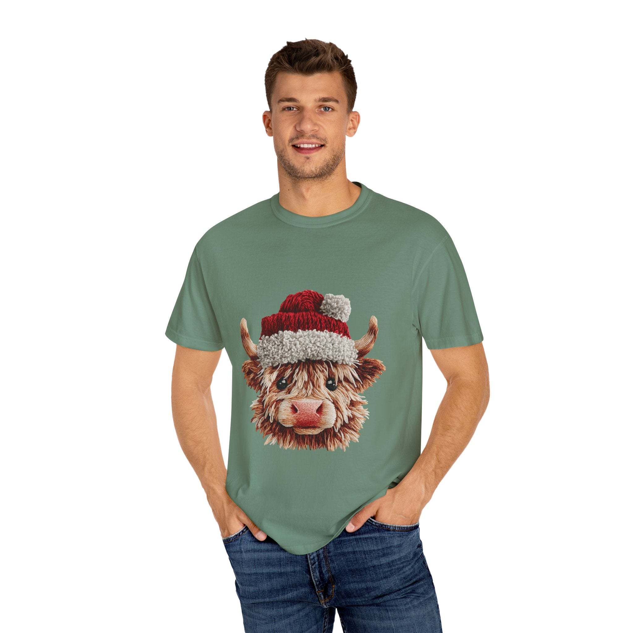 Man wearing green T-shirt with faux crochet yarn Highland cow Santa print