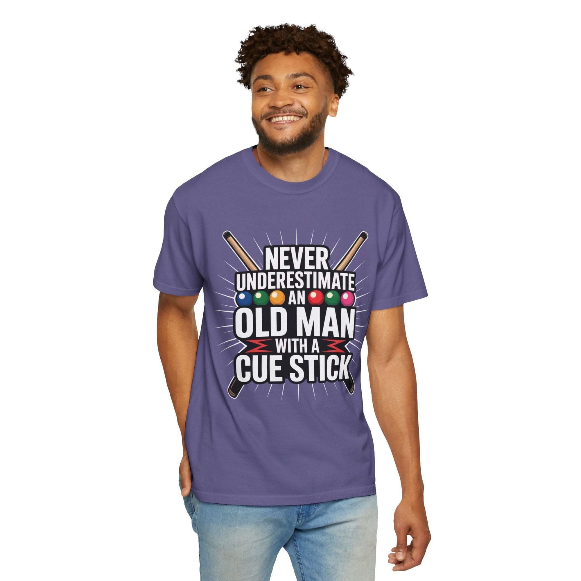 Man wearing a purple t-shirt with humorous text and graphics on a white background