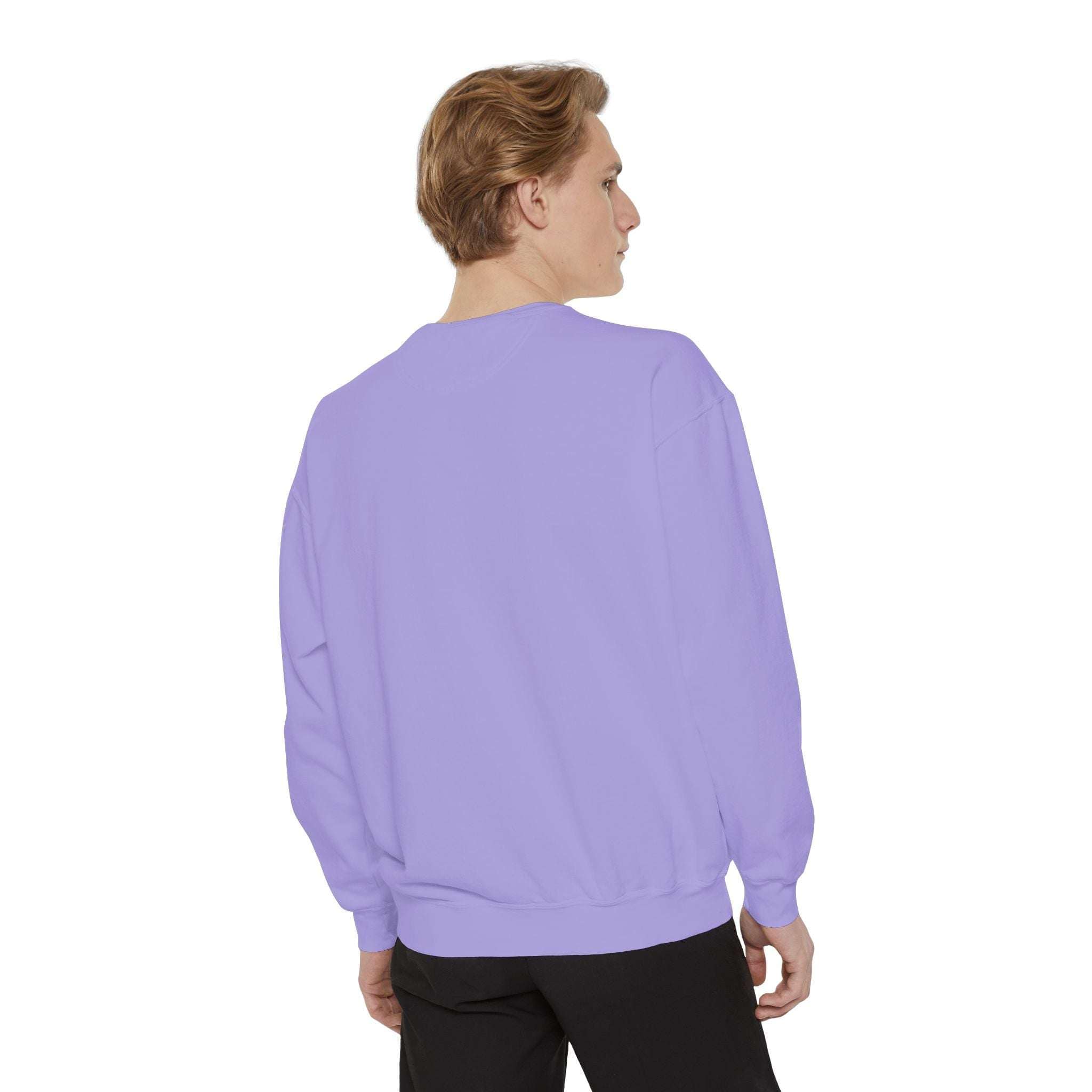 back view of man wearing lavender ultra-soft iridescent merry christmas sweatshirt with relaxed fit and ribbed cuffs