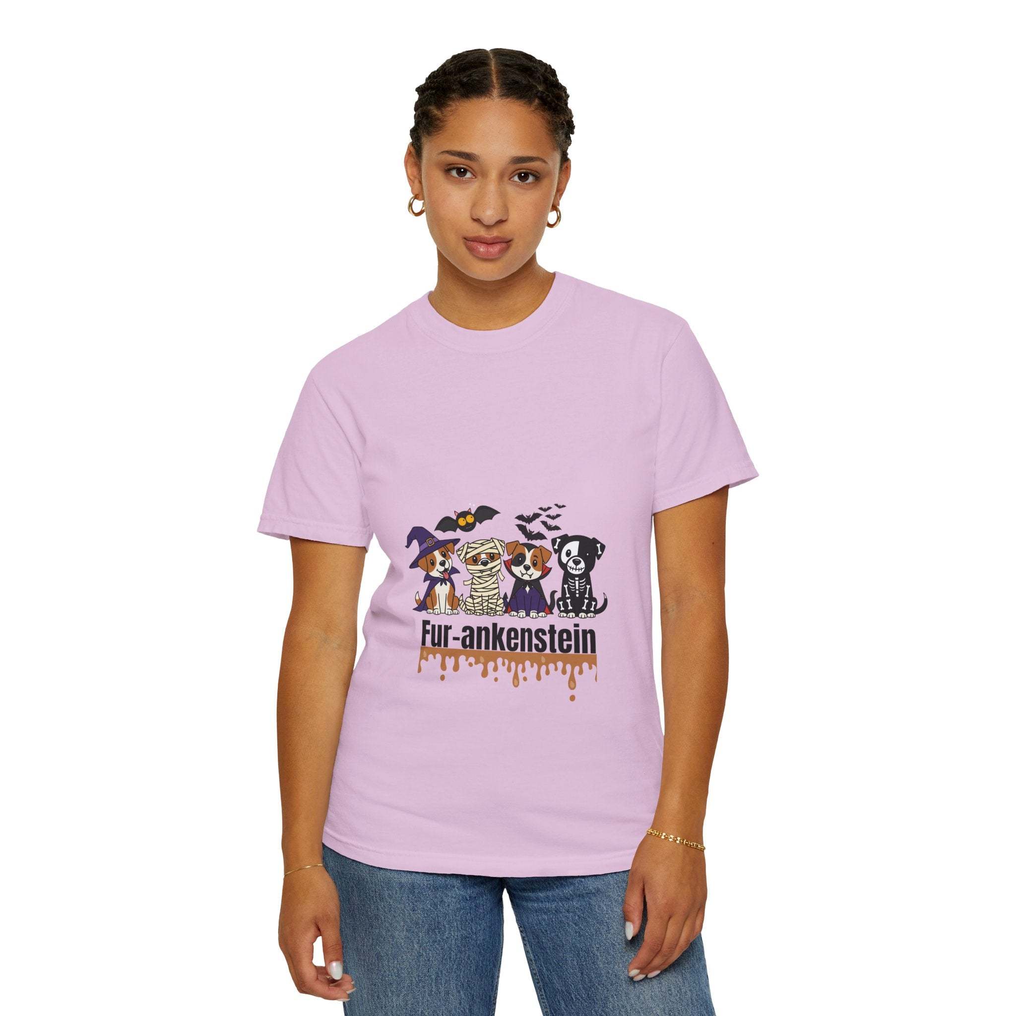Woman wearing lilac puppies Halloween T-shirt with dogs in costumes and "Fur-ankenstein" text