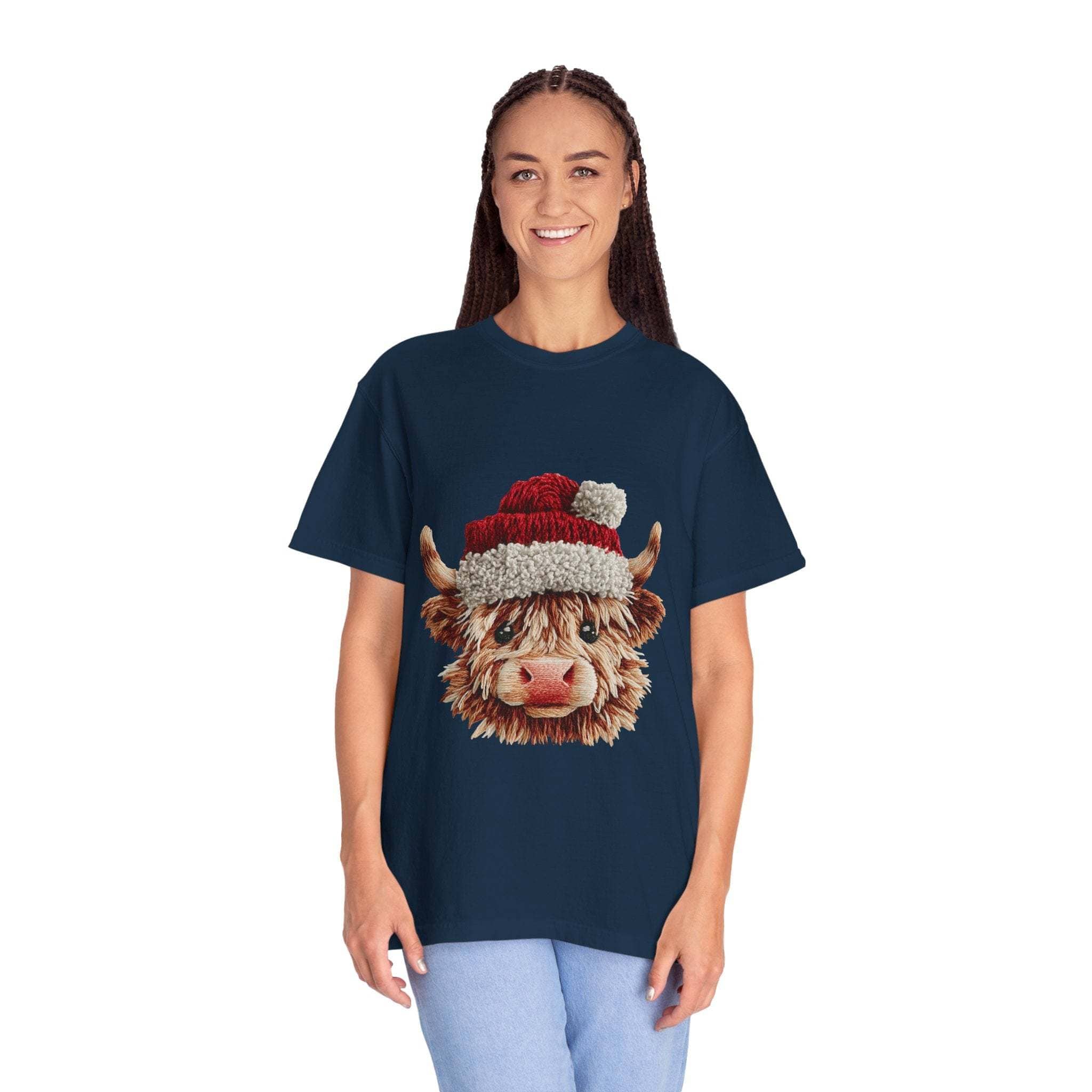 Woman wearing navy T-shirt with faux crochet yarn Highland cow Santa print festive design