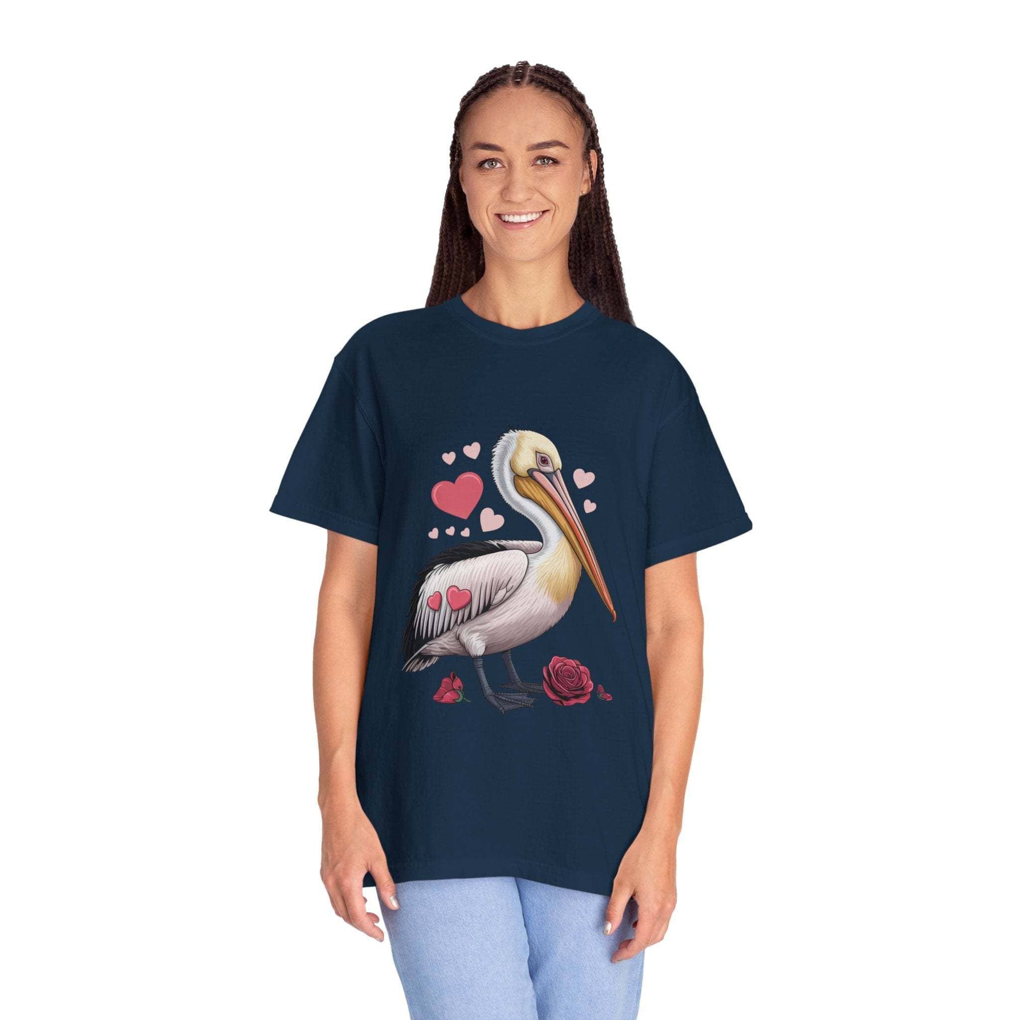 Valentine Pelican Hearts T-Shirt with pelican carrying a heart on a sunlit shoreline, soft cotton and relaxed fit for coastal style