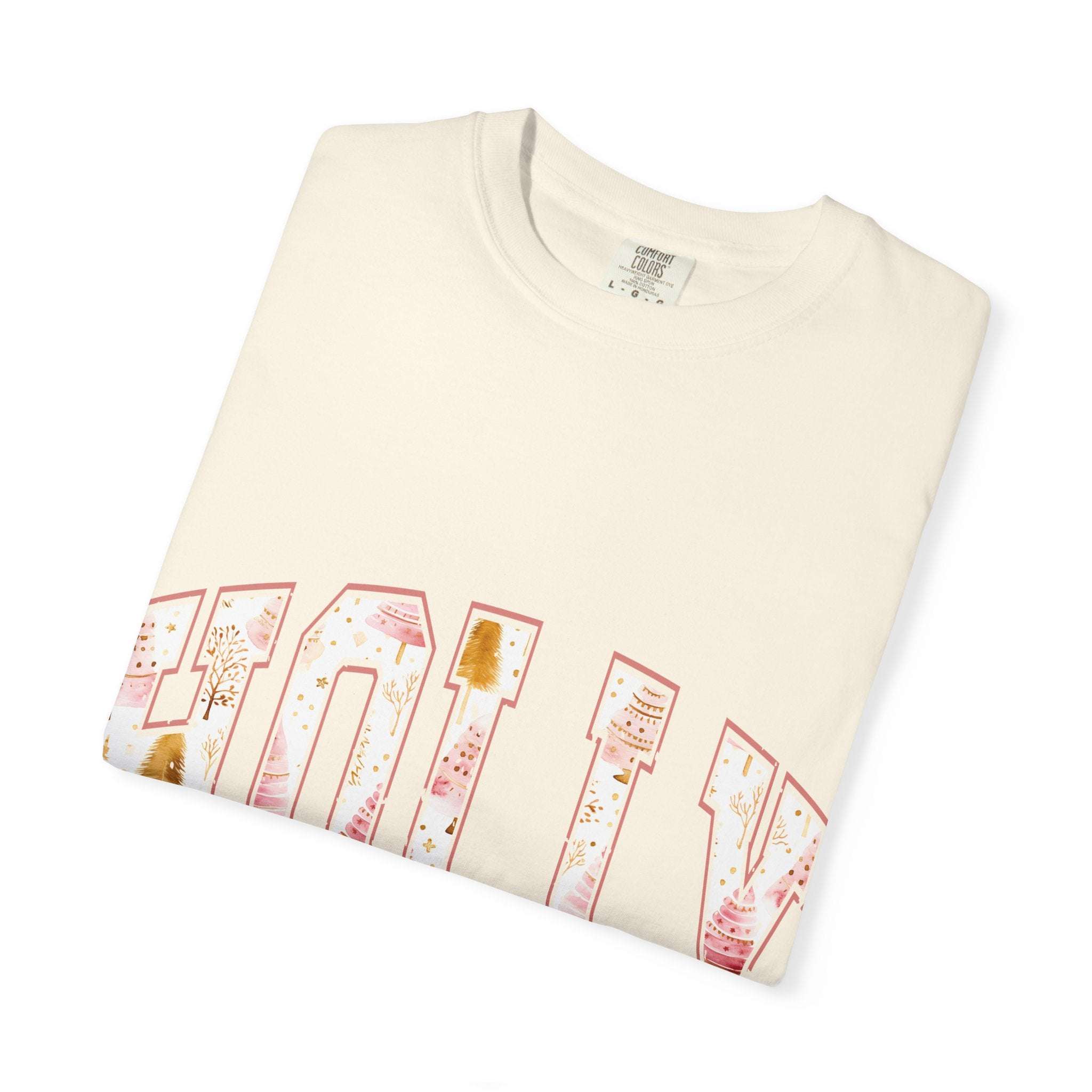 Folded cream Varsity Holly Jolly T-shirt with festive holiday print, made from soft garment-dyed 100% ring-spun US cotton.