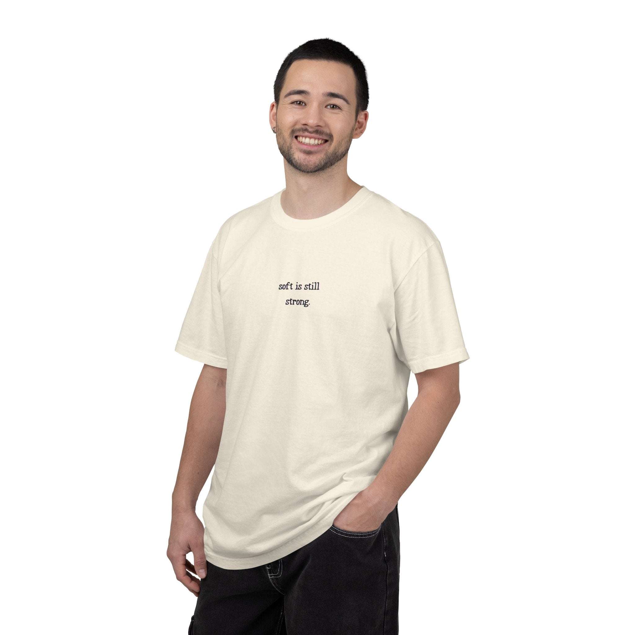 Man wearing a white t-shirt with text on a white background