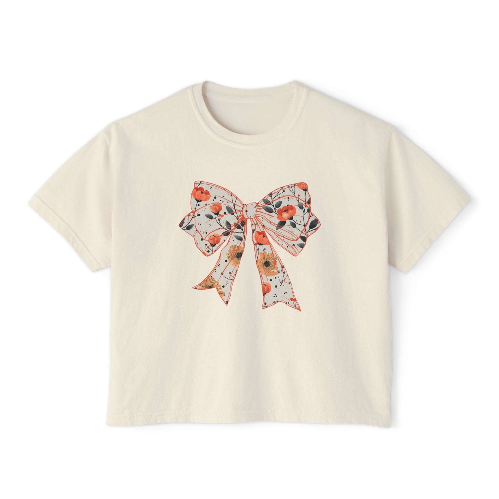 Floral coquette bow design womens tee in butter color, boxy fit, vintage cotton material by Printify