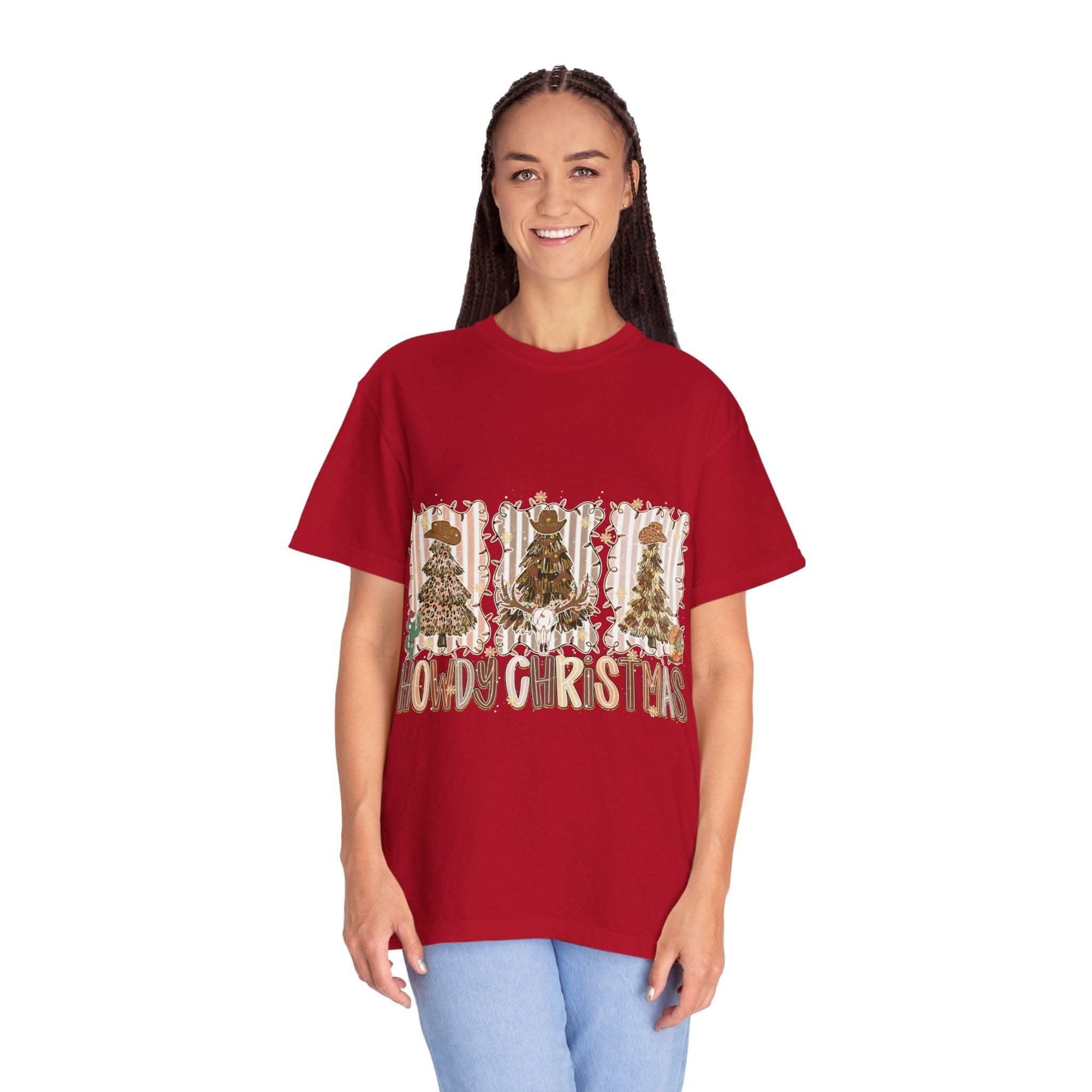 Cowboy Howdy Christmas red t-shirt with festive cowboy tree design worn by smiling woman