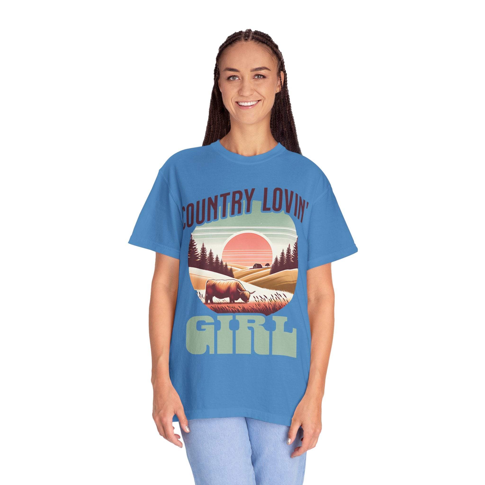 Country Lovin Girl T-shirt with vintage country landscape design in blue, worn by smiling woman