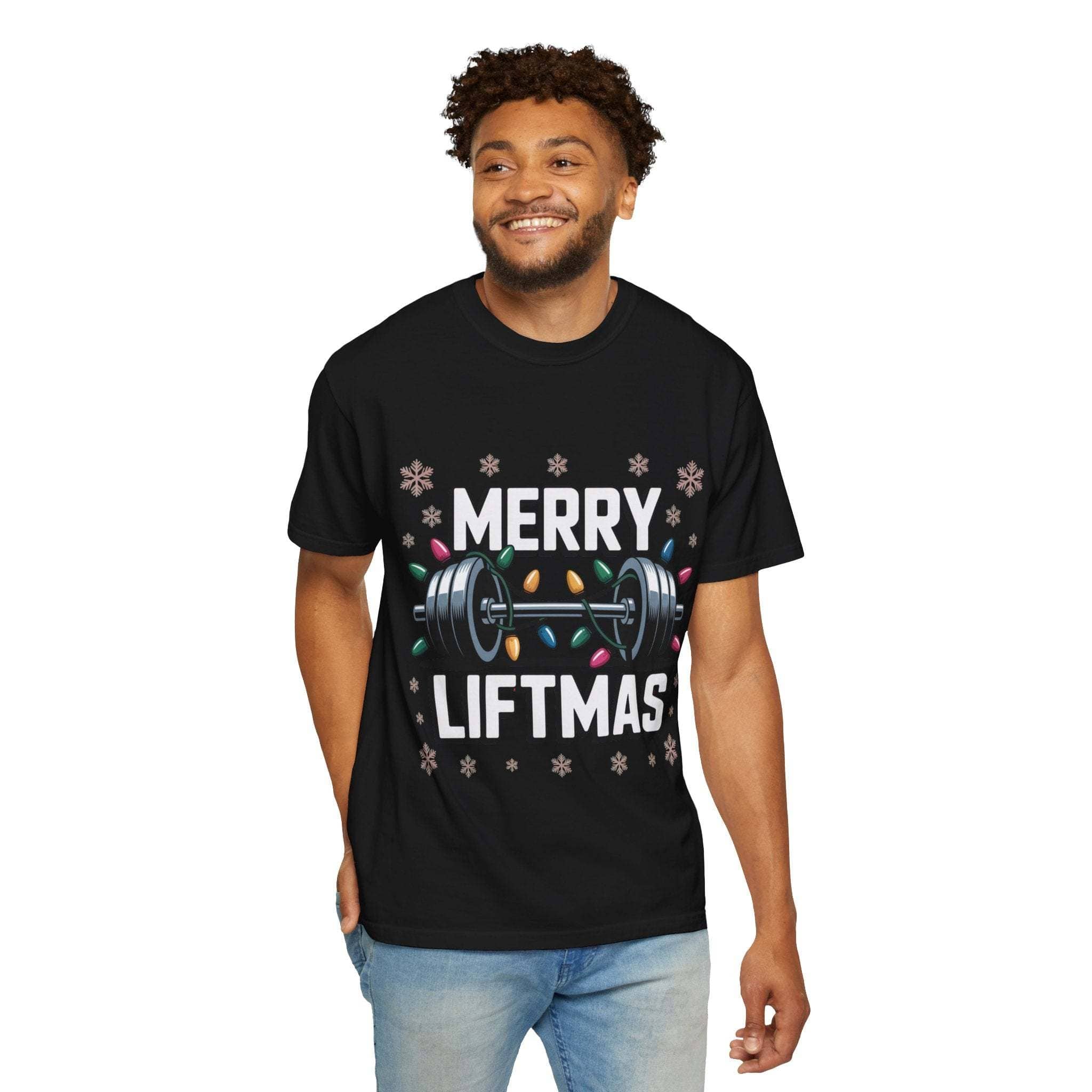 Man wearing black Merry Liftmas Christmas Workout T-shirt with barbell and holiday lights design