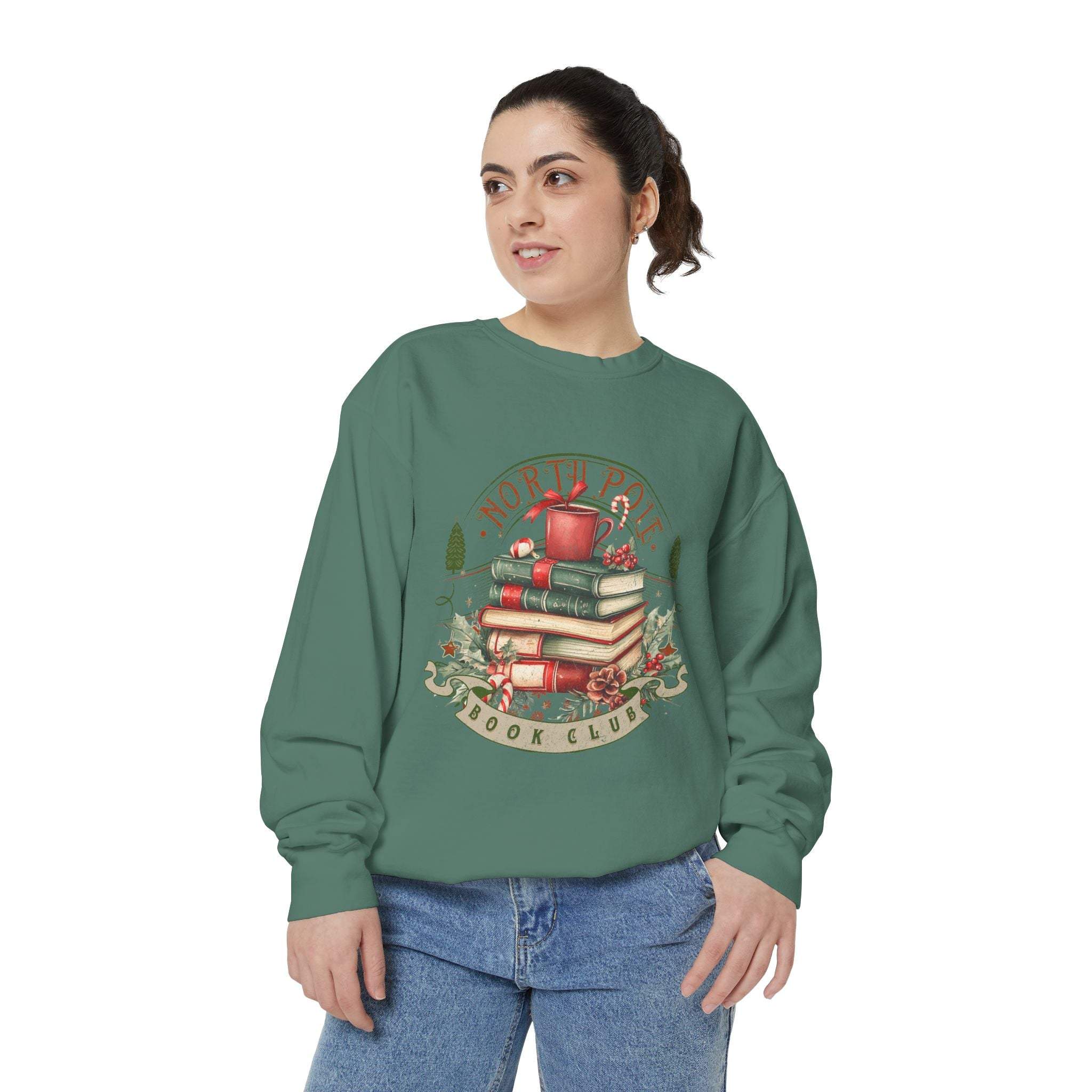 Woman wearing vintage North Pole Book Club green sweatshirt with holiday book stack design