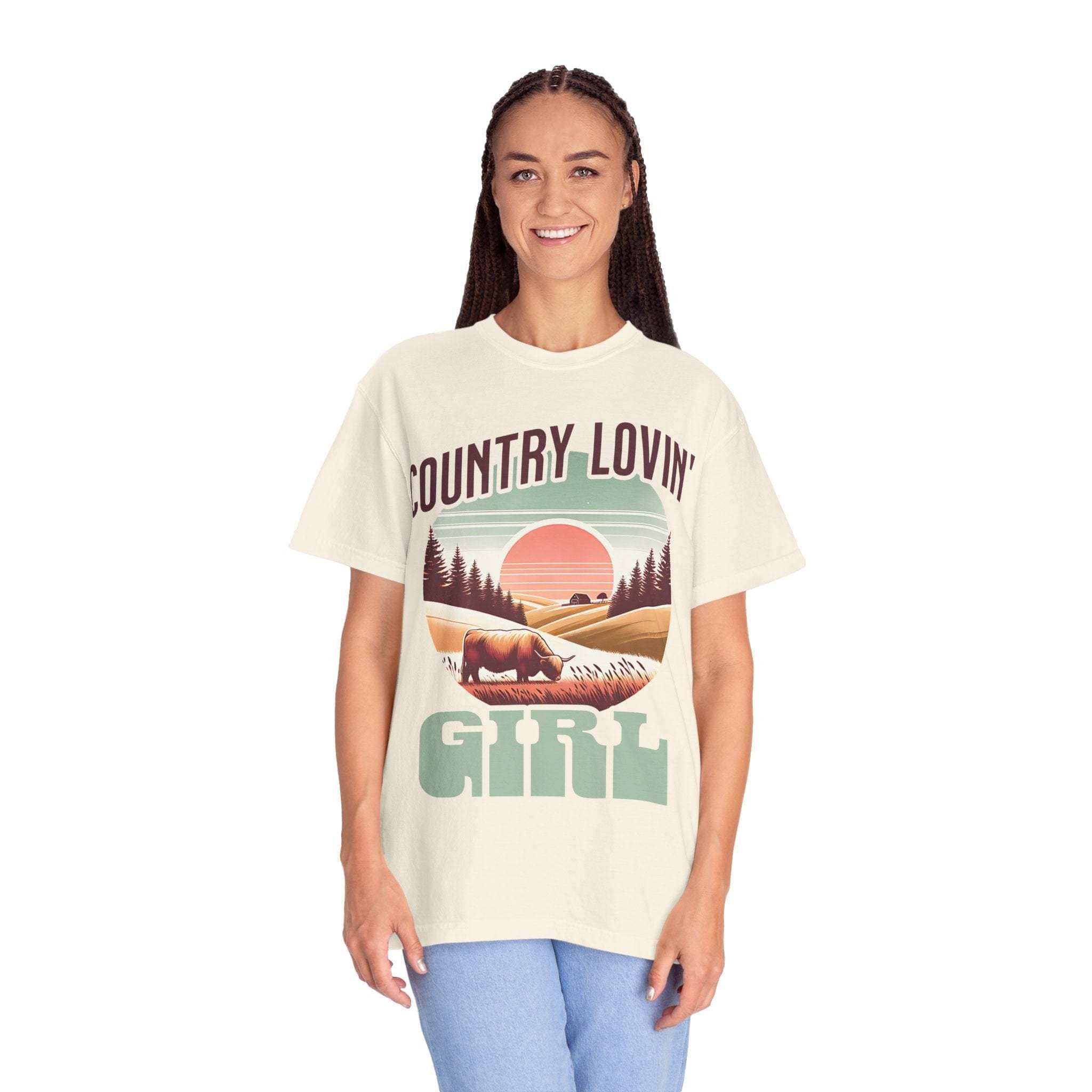Woman wearing vintage style Country Lovin Girl T-shirt with rural sunset and horse graphic