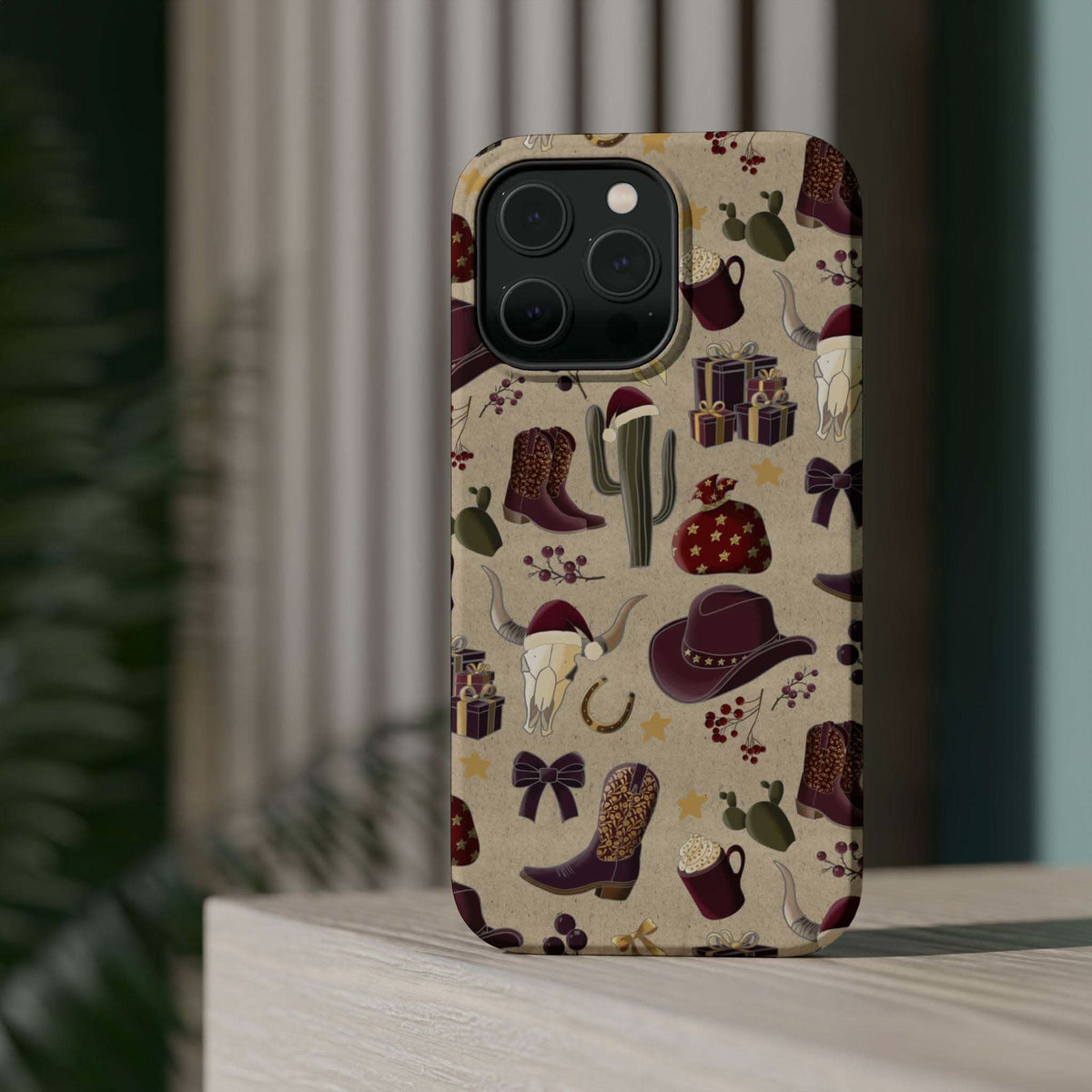 Cowboy Christmas design phone case for iPhone 17 in glossy finish by Printify, featuring festive colors and patterns.