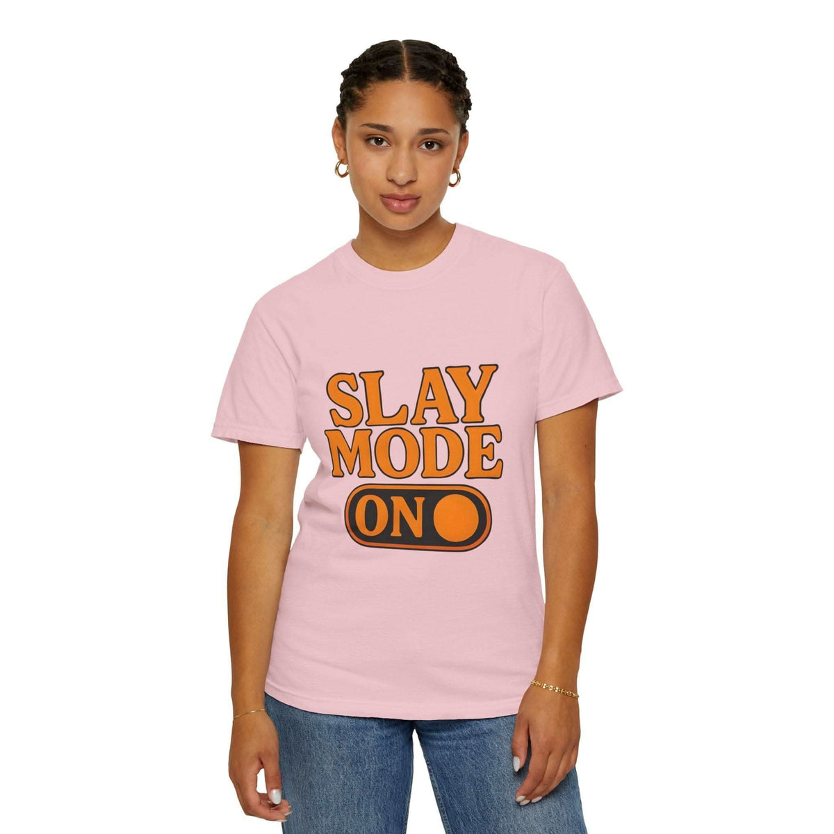 Woman wearing pink garment-dyed tee with "Slay Mode On" text in bold orange letters