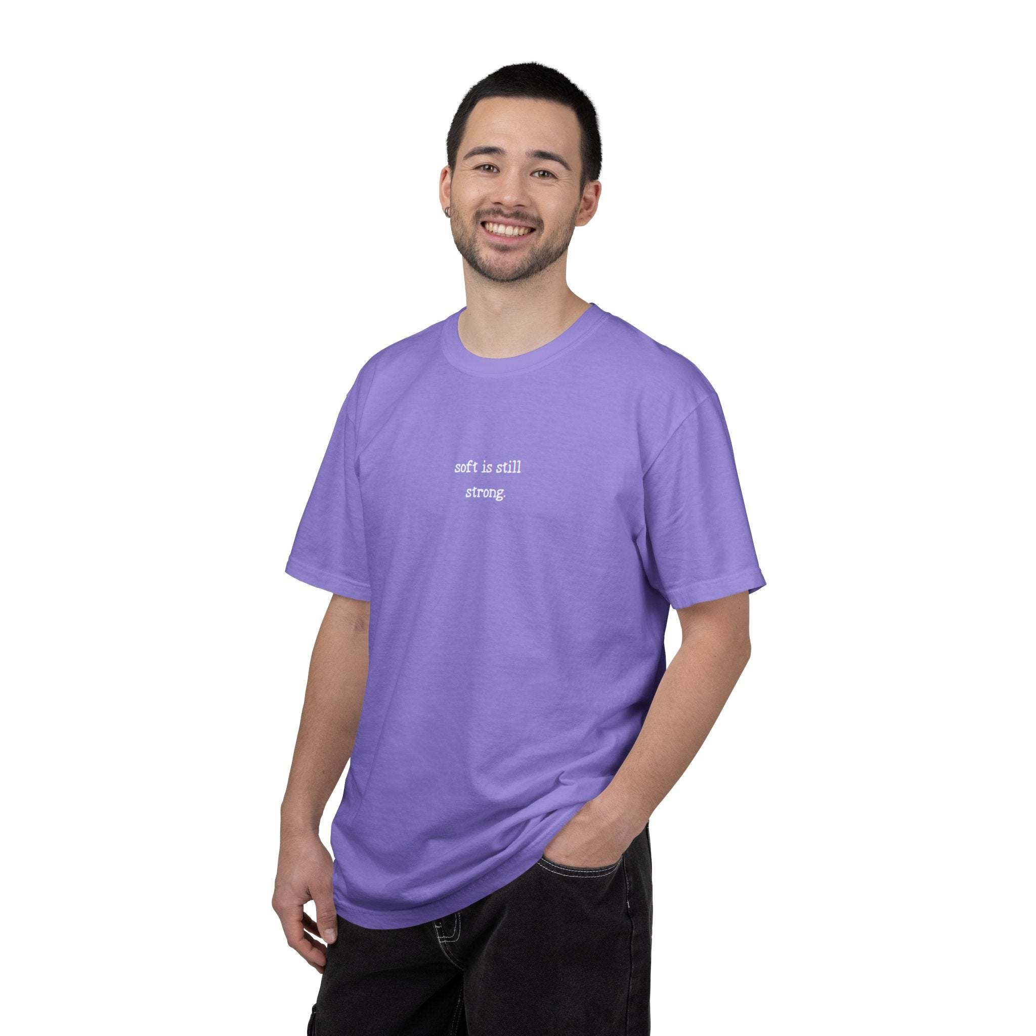 Man wearing a purple t-shirt with text on a white background