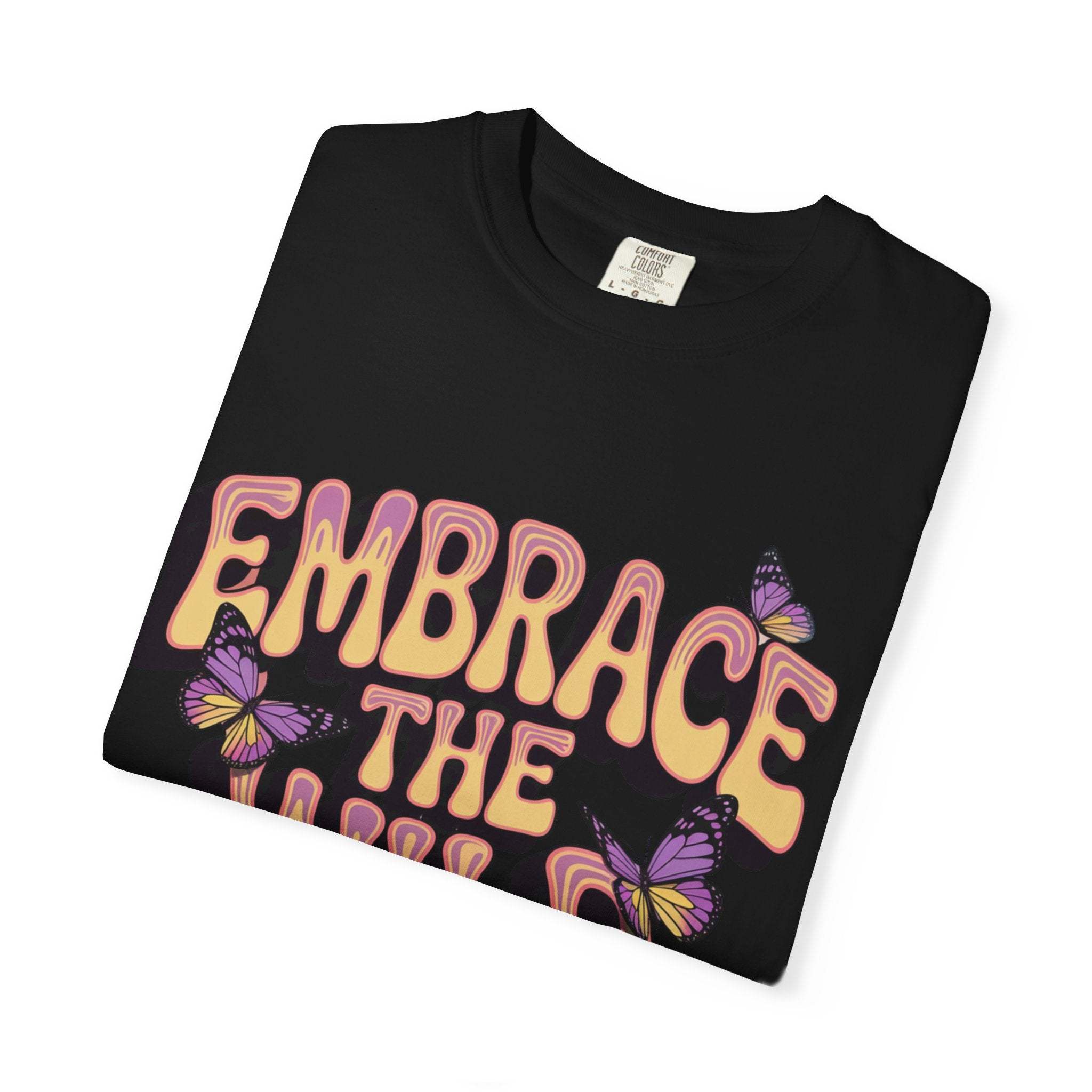 Black garment-dyed T-shirt with "Embrace the Wild Side" print and butterfly design, unisex cotton tee.