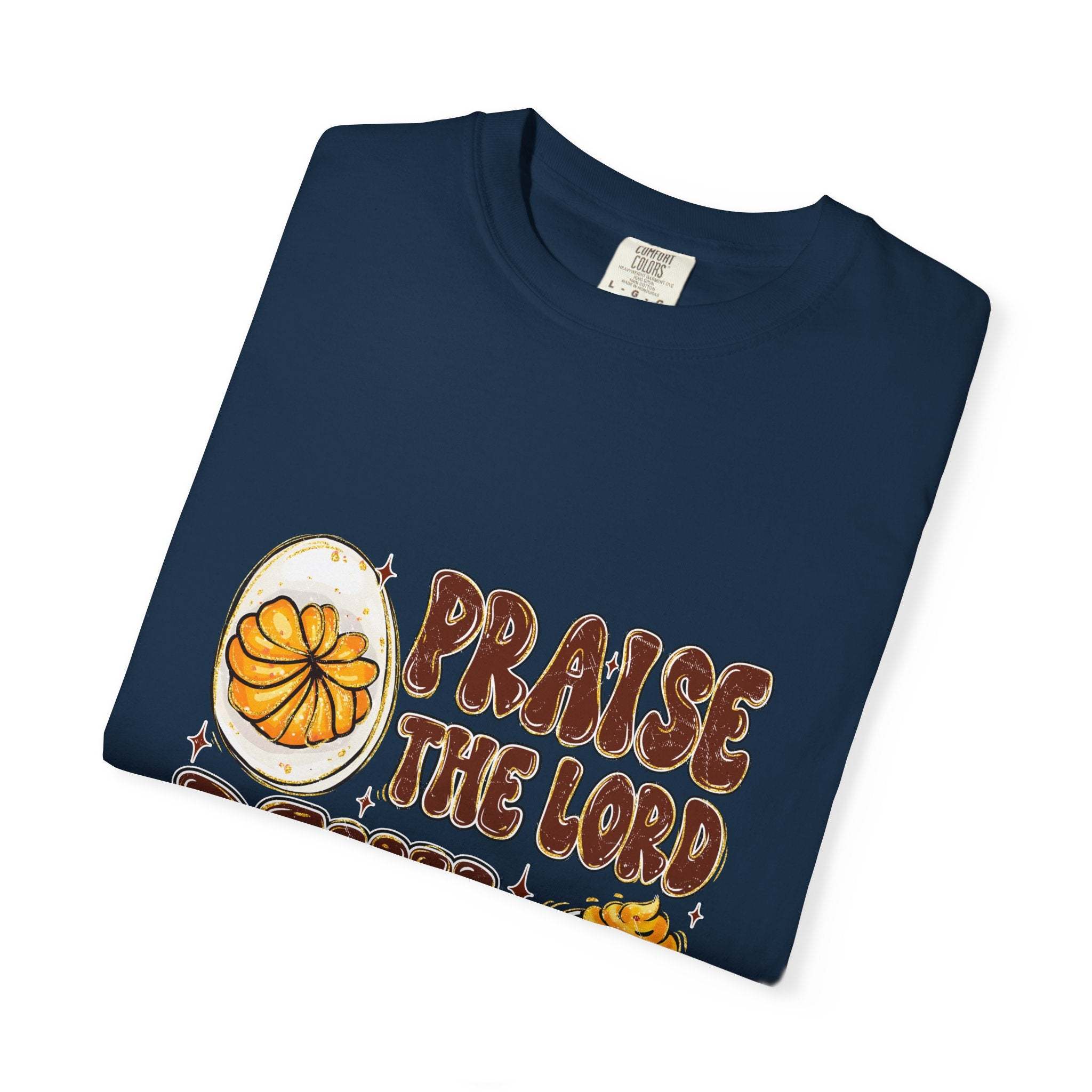 White cotton t-shirt featuring 'Praise the Lord, Devil the Eggs' design, perfect for Easter and Christian apparel.