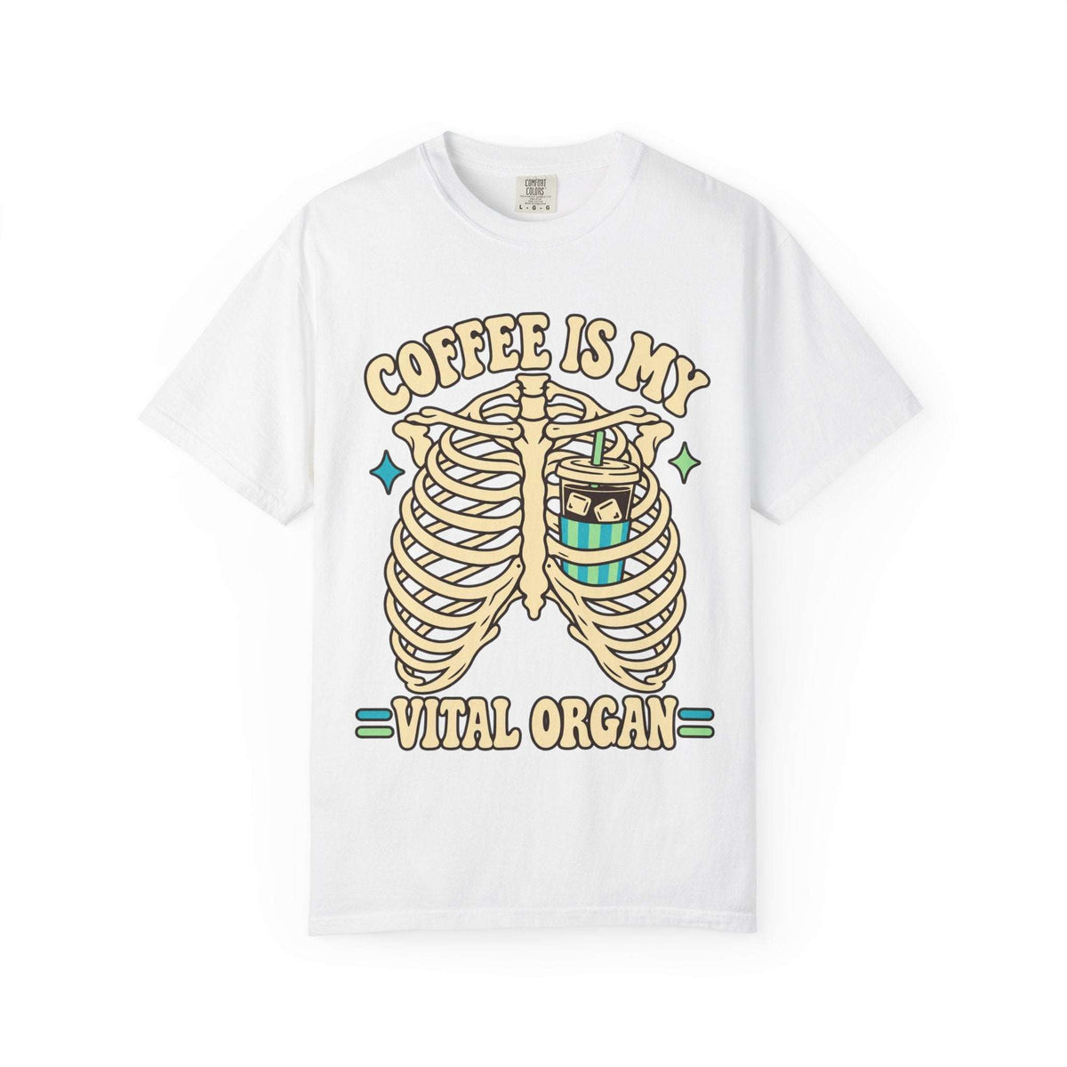 A white short-sleeve crewneck t-shirt featuring a graphic print of a rib cage with a coffee cup inside, and the text 'COFFEE IS MY VITAL ORGAN' in a beige retro font.