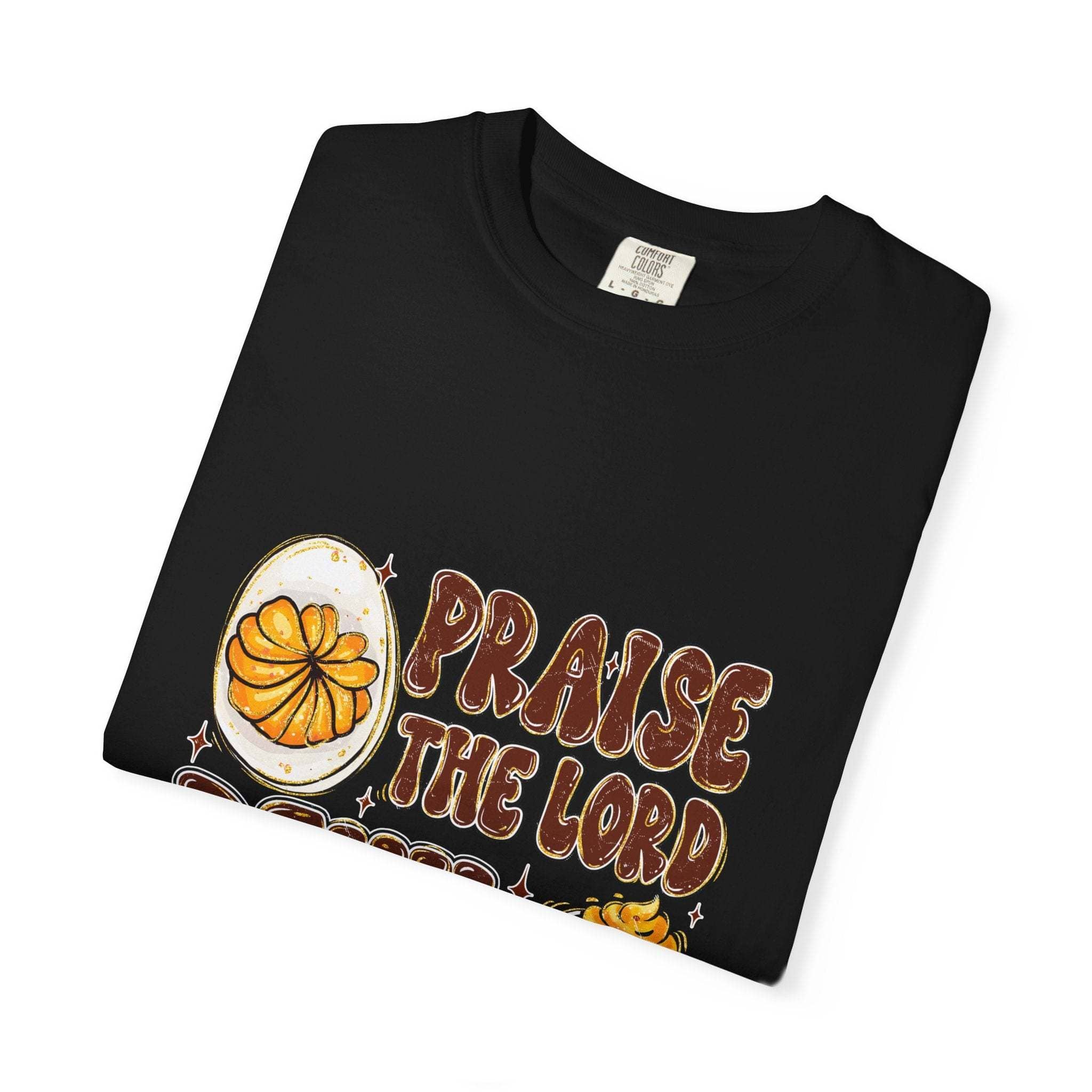 White cotton t-shirt featuring 'Praise the Lord, Devil the Eggs' design, perfect for Easter and Christian apparel.