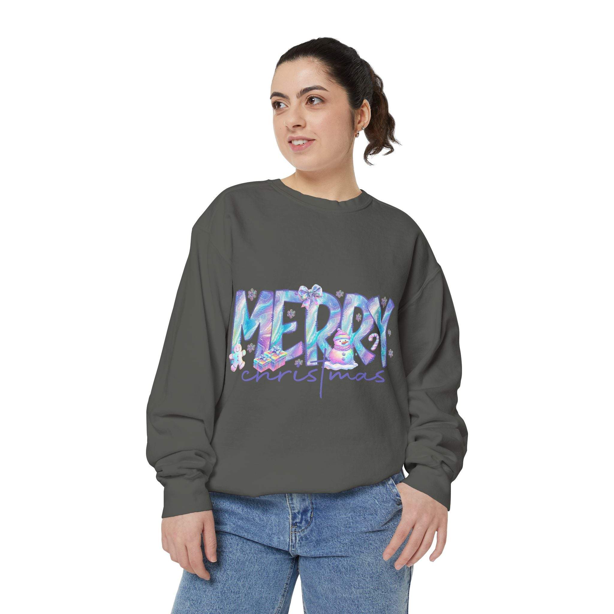 Woman wearing gray sweatshirt with iridescent Merry Christmas design on front, casual holiday sweater