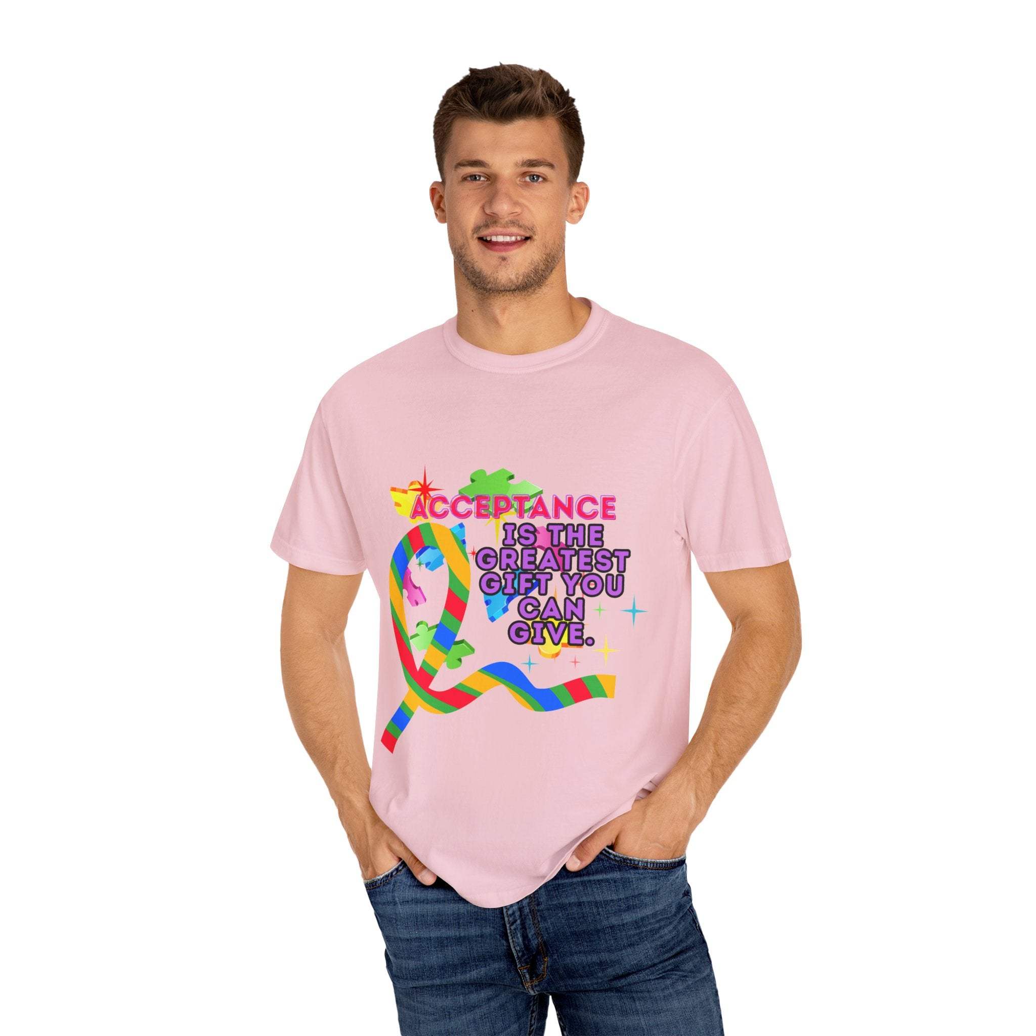 Garment-dyed pink T-shirt with Autism Acceptance ribbon graphic and supportive message worn by man