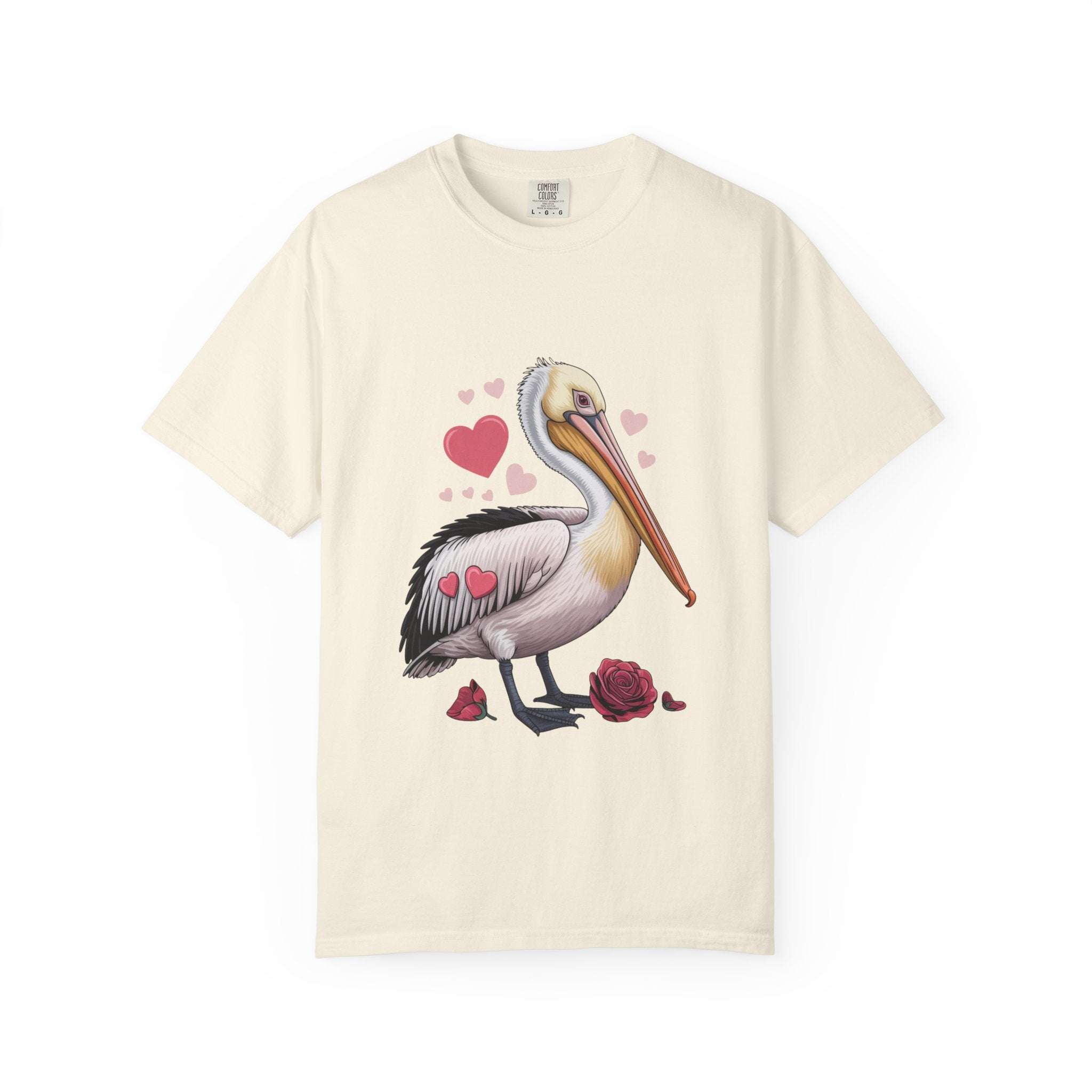 Valentine Pelican Hearts T-Shirt with playful pelican and heart design on sunlit shoreline in soft garment-dyed cotton