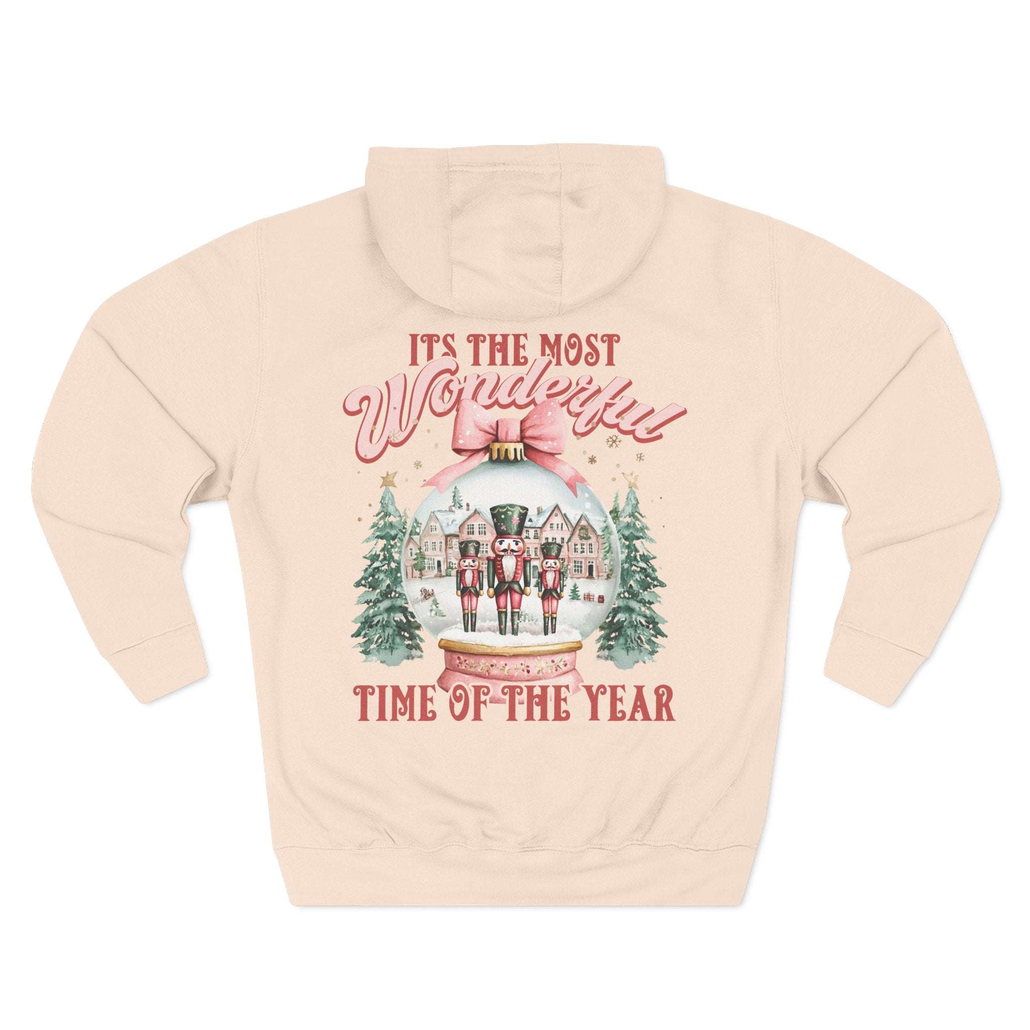 Preppy pink fleece hoodie with vintage snow globe and nutcracker design for cozy winter comfort