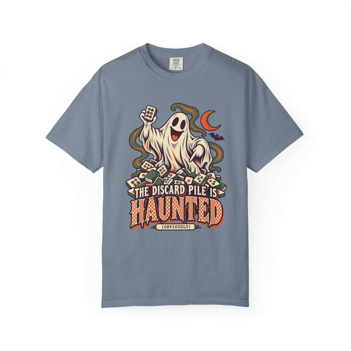 Blue jean Comfort Colors 1717 Halloween mahjong T-shirt with a ghost holding a tile and “The Discard Pile Is Haunted (Obviously)” lettering.