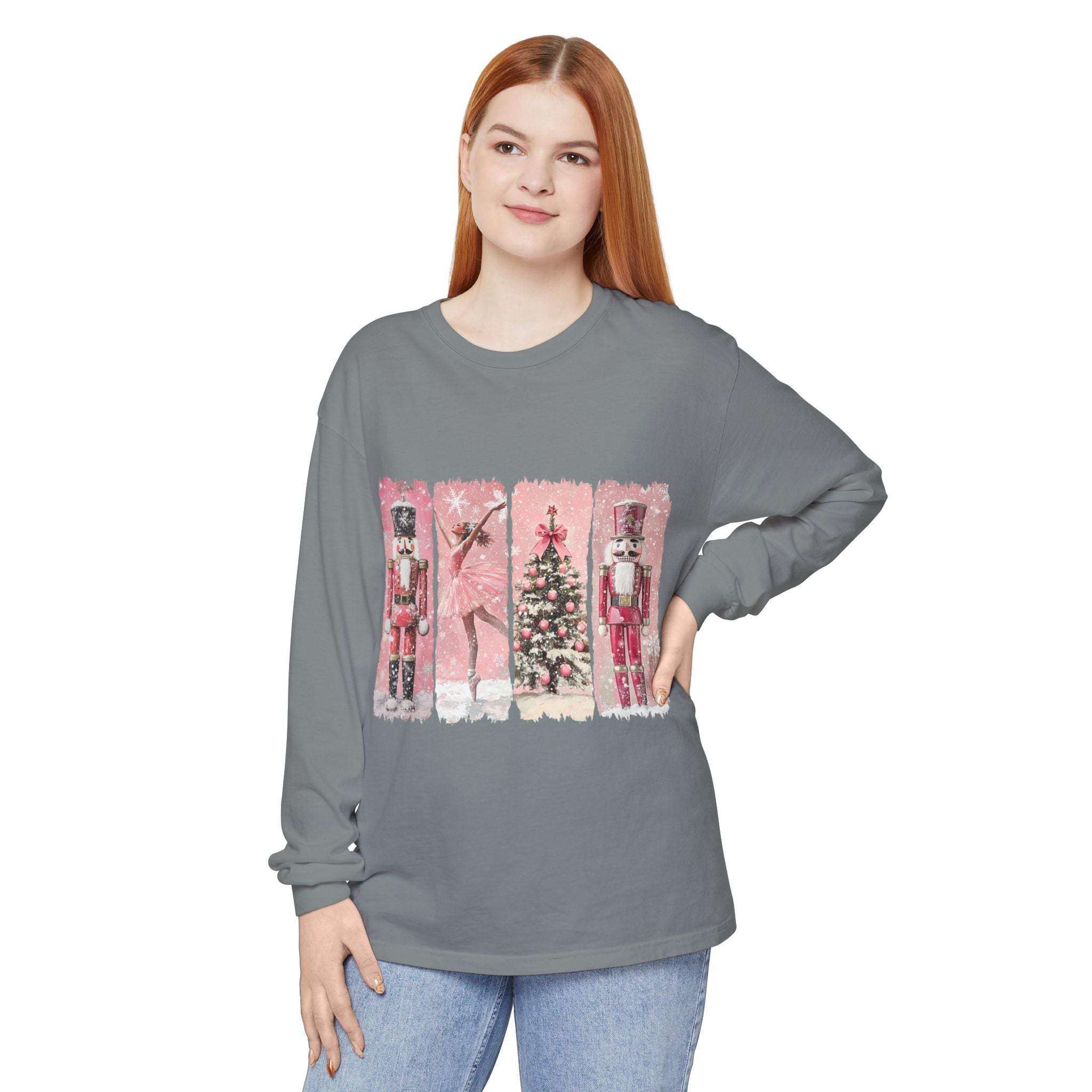 Woman wearing long sleeve t-shirt with pink watercolor Nutcracker Christmas design