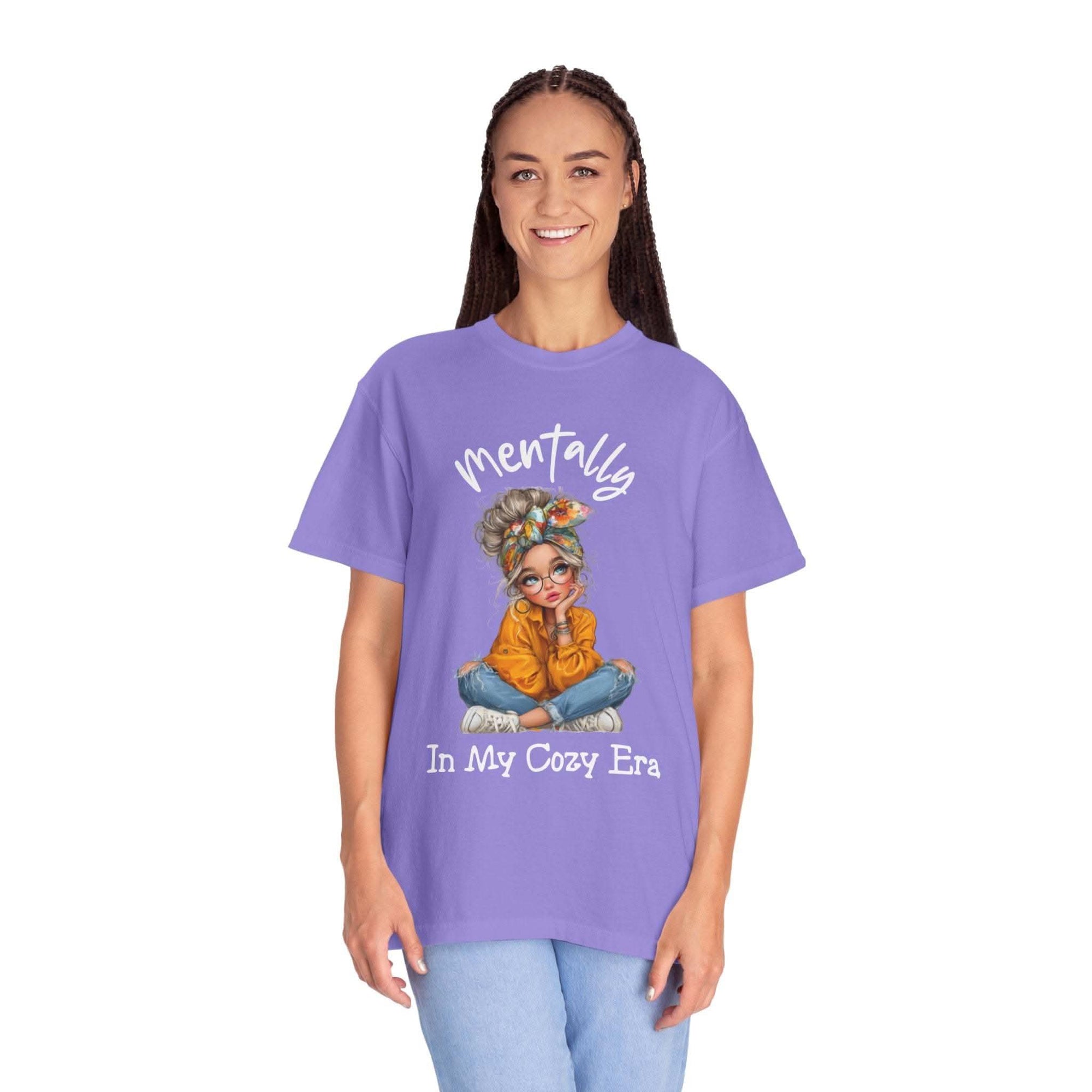 Woman wearing lavender Mentally in My Cozy Era t-shirt with cozy graphic design