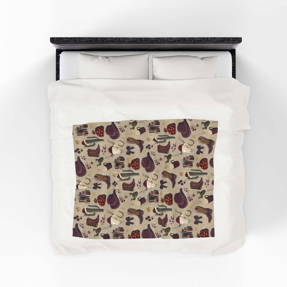 Cowboy Christmas design plush blanket with soft velveteen fabric and vibrant patterns on bed