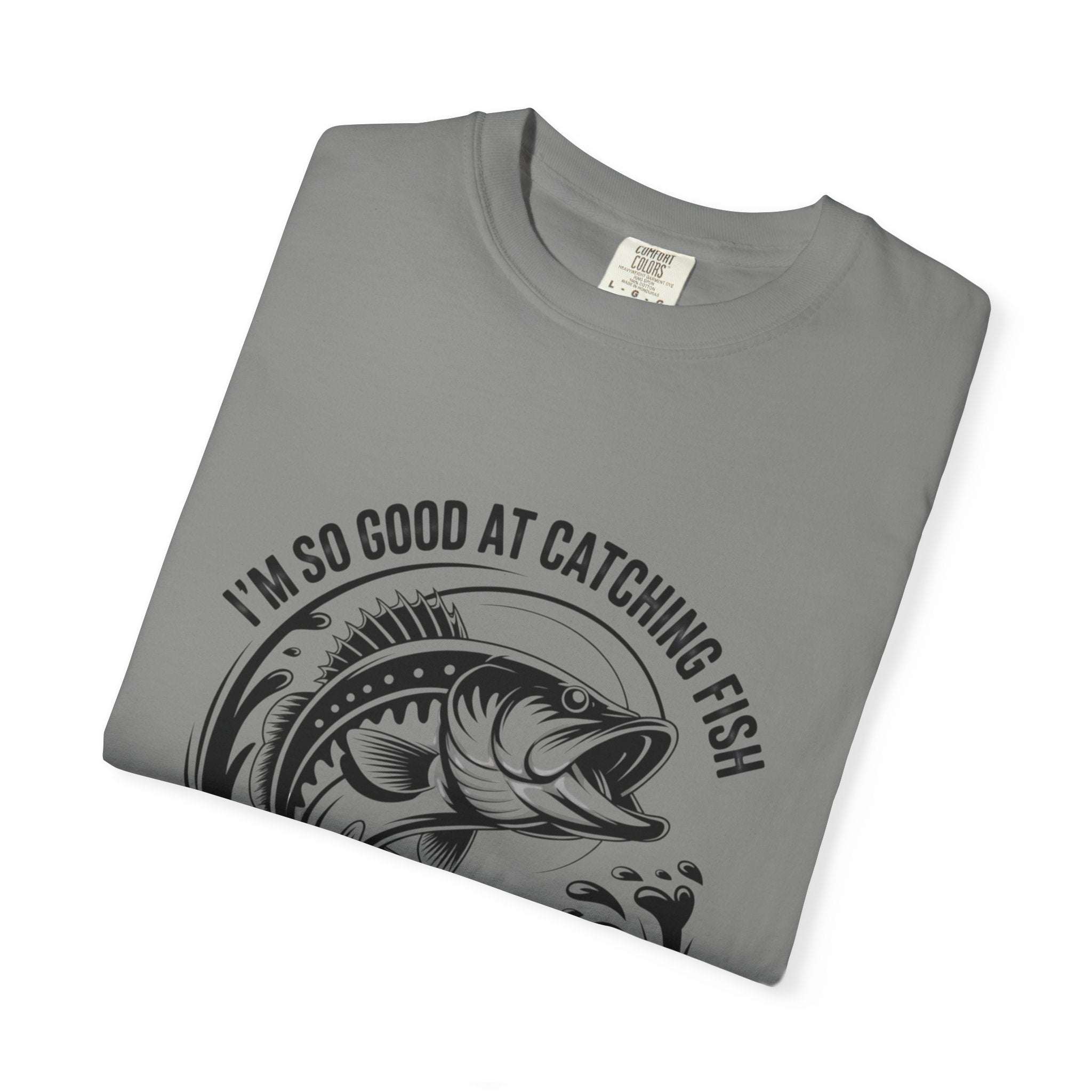 Fishing T-Shirt with humorous "So Good At Catching Fish That The Fish Tell Stories About Me" phrase on relaxed-fit cotton tee