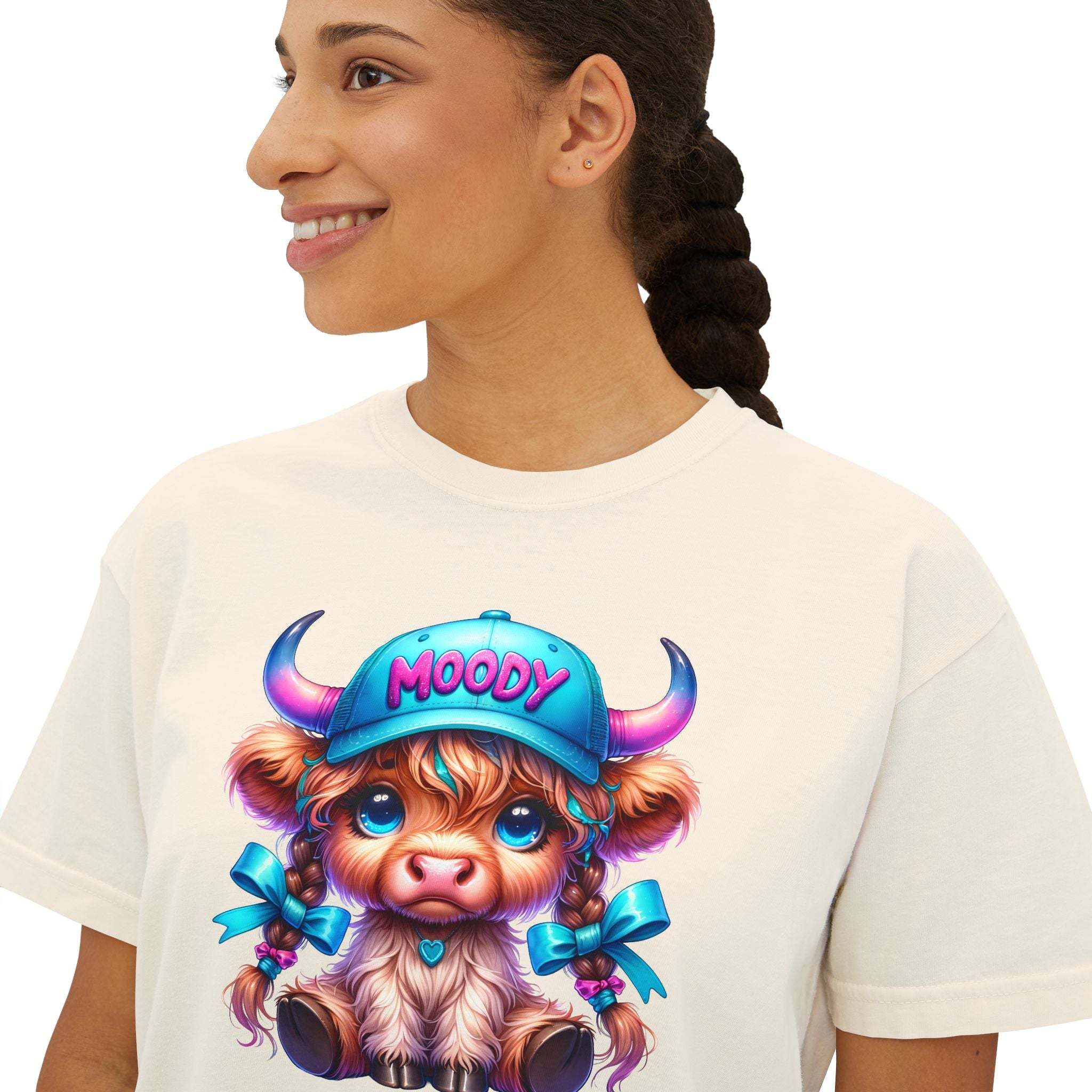 Women's boxy tee featuring a moody girl highland cow graphic, 100% cotton, vintage pigment dye, casual fit