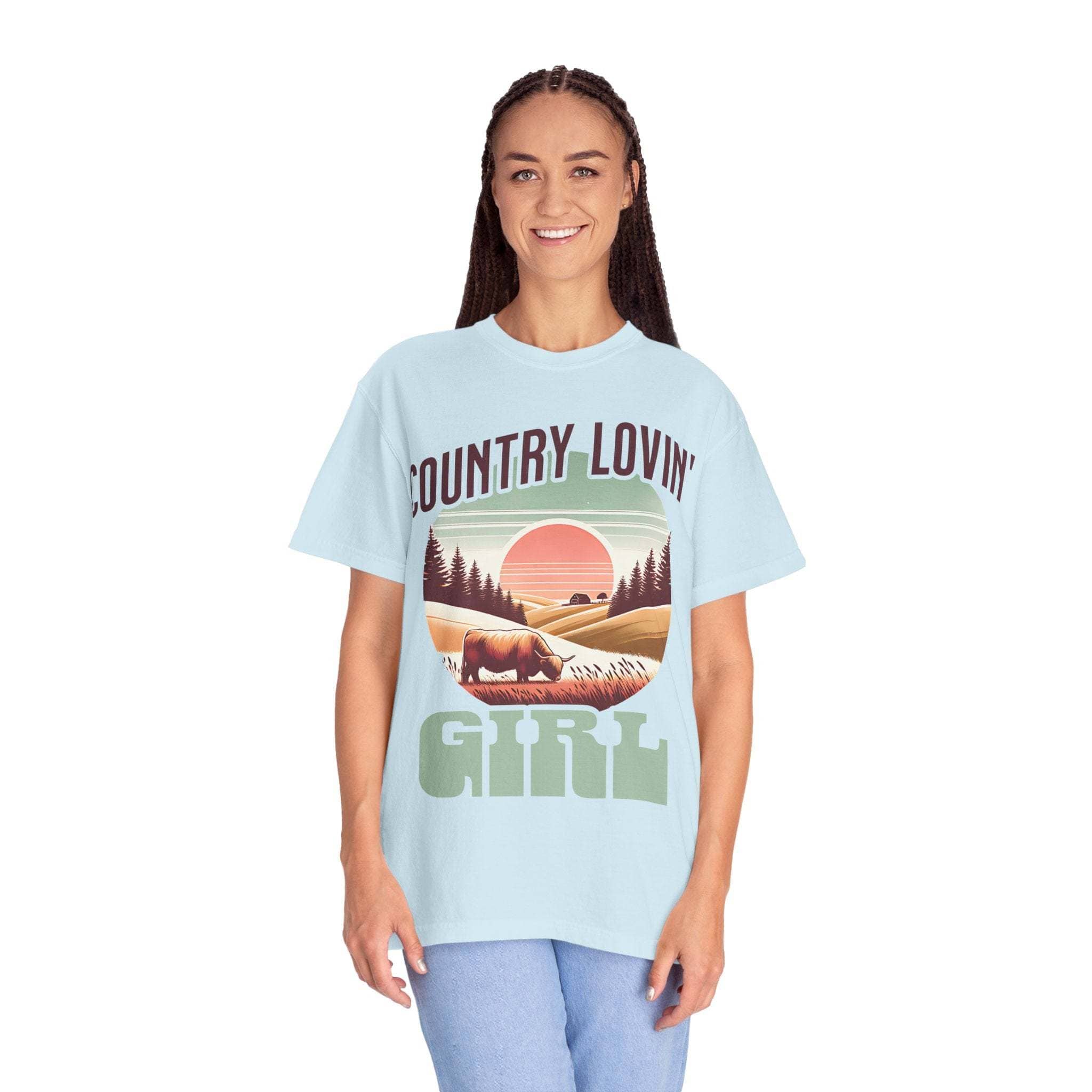 Woman wearing light blue Country Lovin Girl T-shirt with vintage countryside graphic and relaxed fit