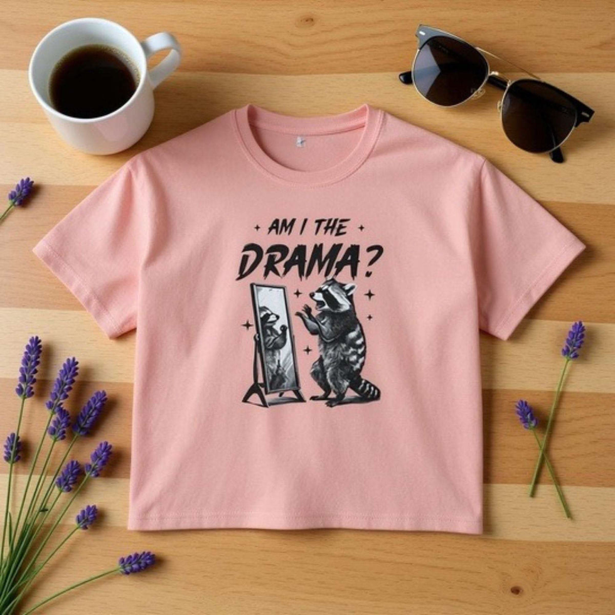 Pink Boxy Tee with "Am I The Drama?" graphic and raccoon illustration on front