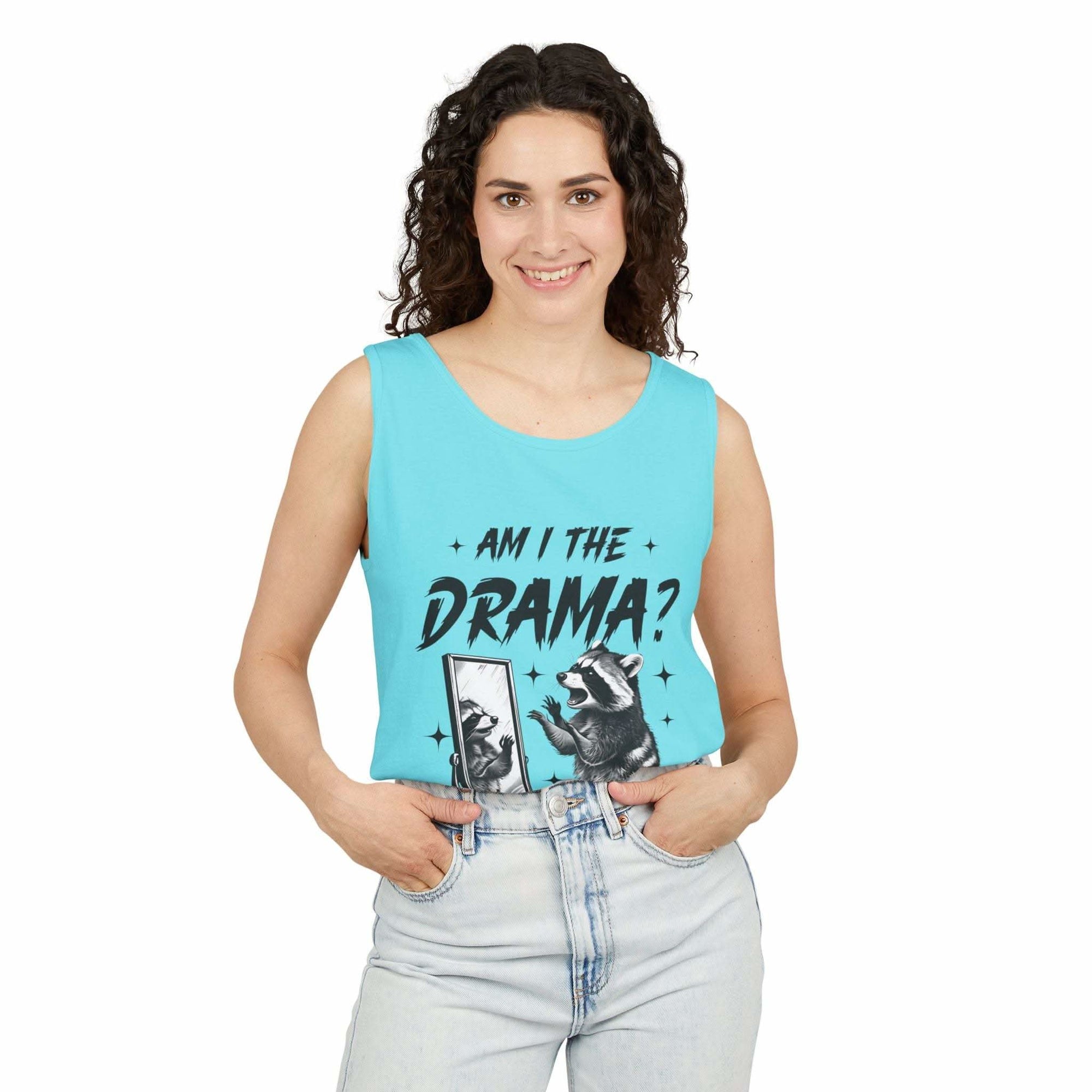 Woman wearing light blue tank top with "Am I The Drama?" raccoon design