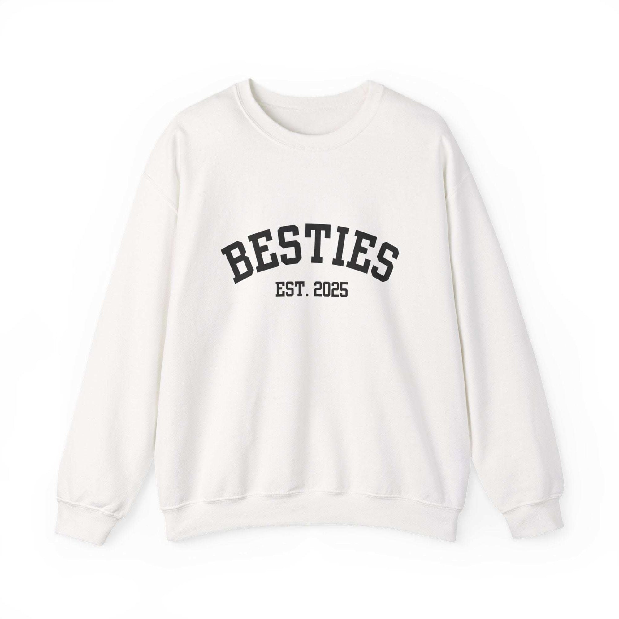 White Varsity Besties Crewneck Sweatshirt with black embroidered "BESTIES EST. 2025" text, classic fit and soft cotton-poly blend.