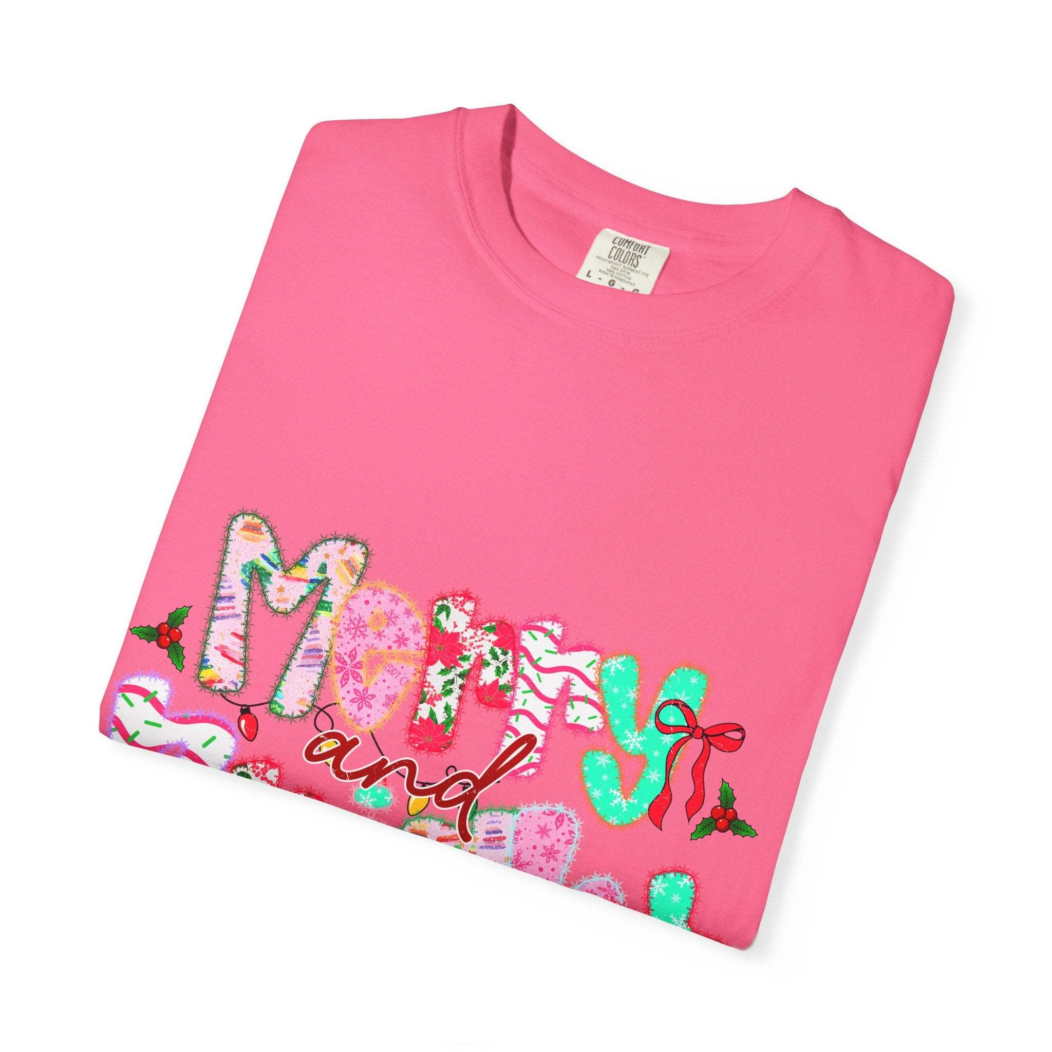 pink Merry and Bright T-shirt with festive holiday lettering and holly accents