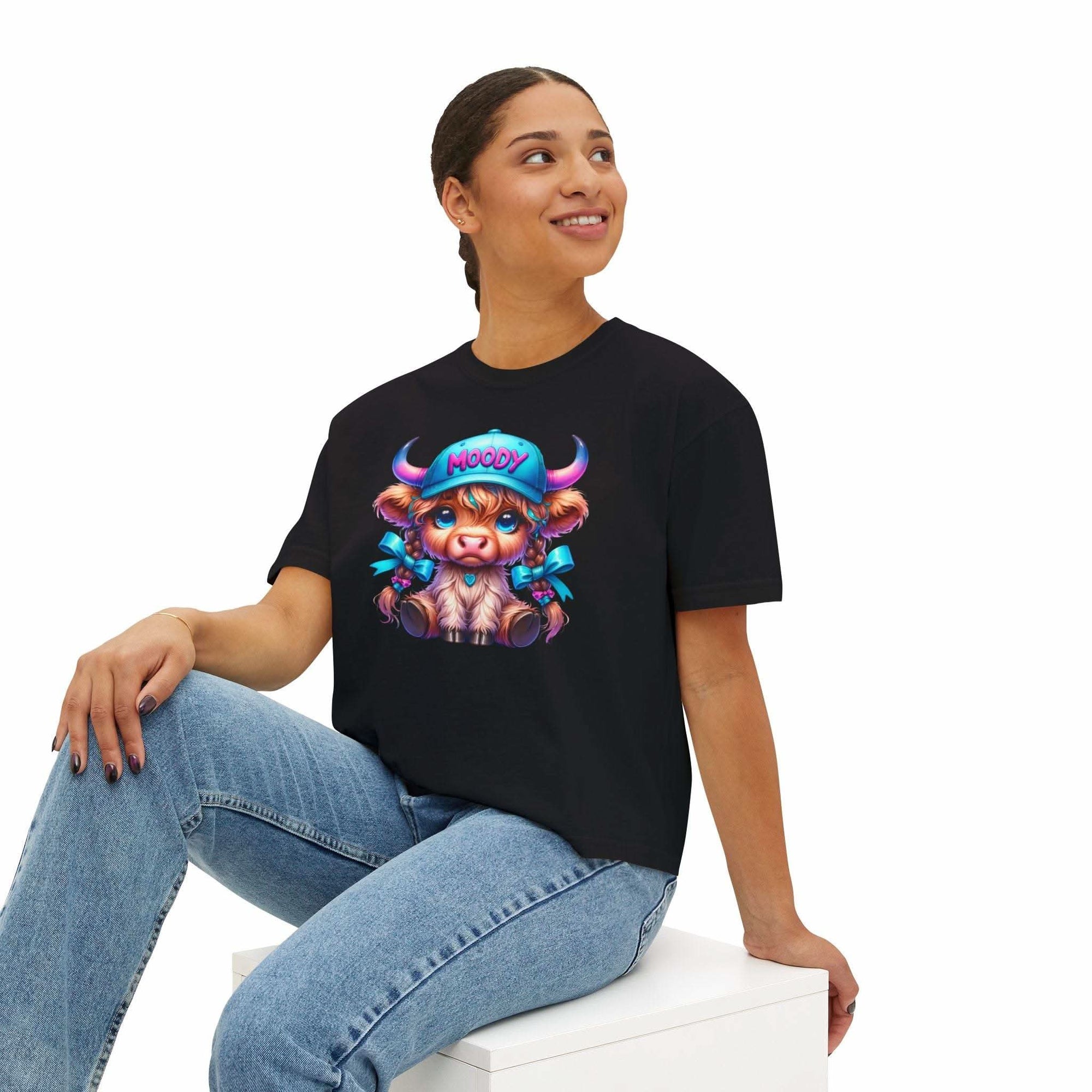 Women's black boxy tee with moody girl highland cow graphic design, casual and vintage style
