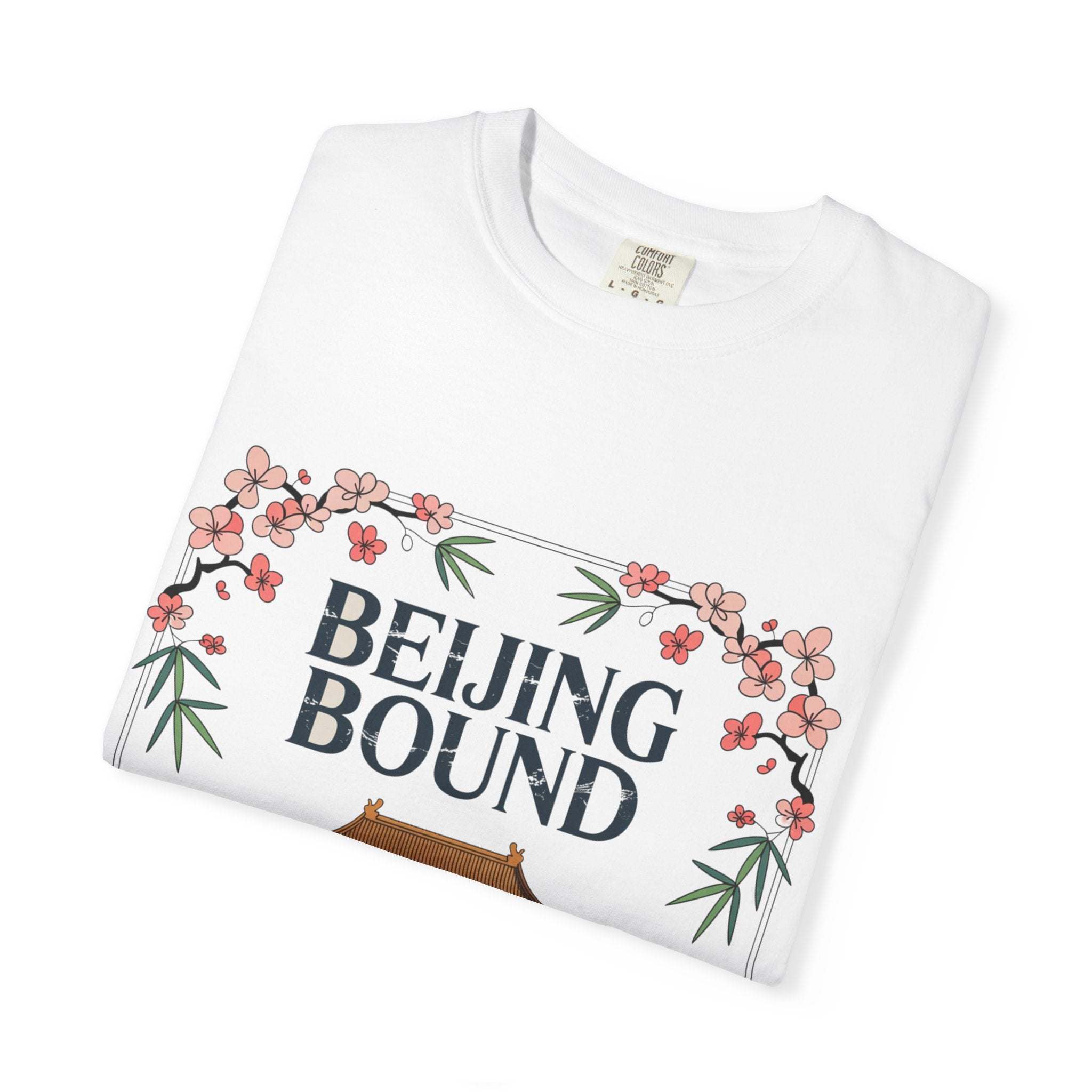 White garment-dyed travel T-shirt with Beijing Bound text and cherry blossom design, made of 100% ring-spun US cotton