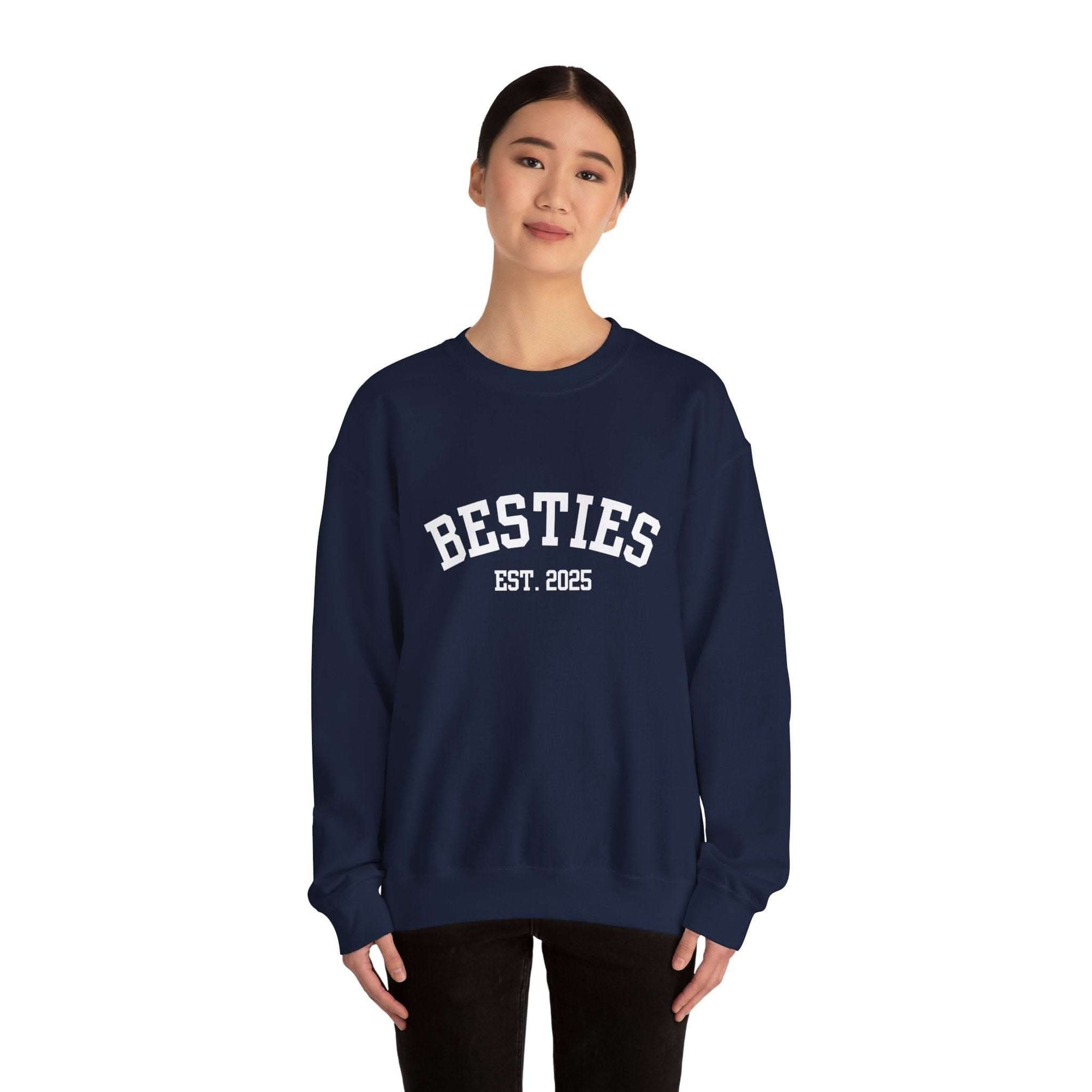 Woman wearing navy Varsity Besties Crewneck Sweatshirt with "Besties Est. 2025" varsity lettering