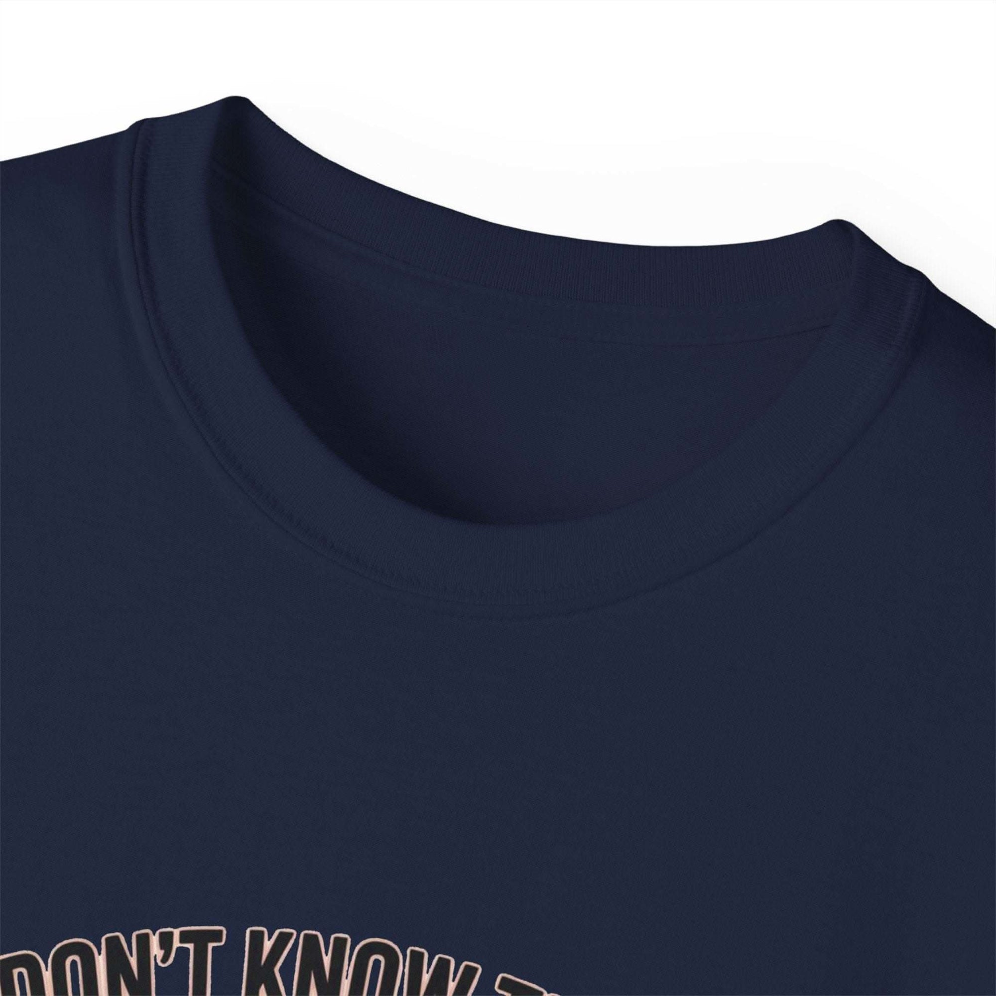 Navy unisex T-shirt with "We Don't Know Them All But We Owe Them All" veteran message, medium-weight cotton fabric.