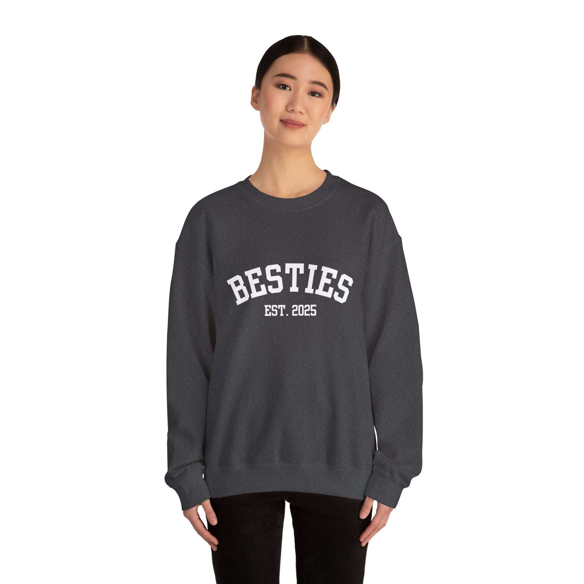 woman wearing black Varsity Besties Crewneck Sweatshirt with Besties Est. 2025 lettering