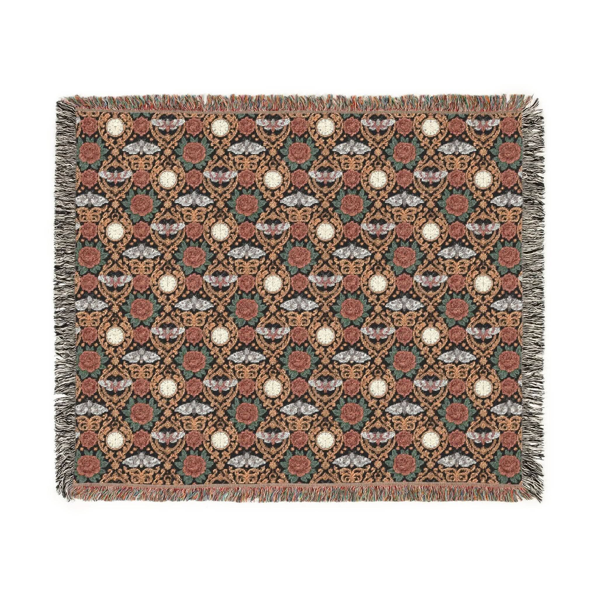 Victorian Gothmas Woven Blanket with candlelight-inspired colors and colorful fringed edges on a dark velvet background