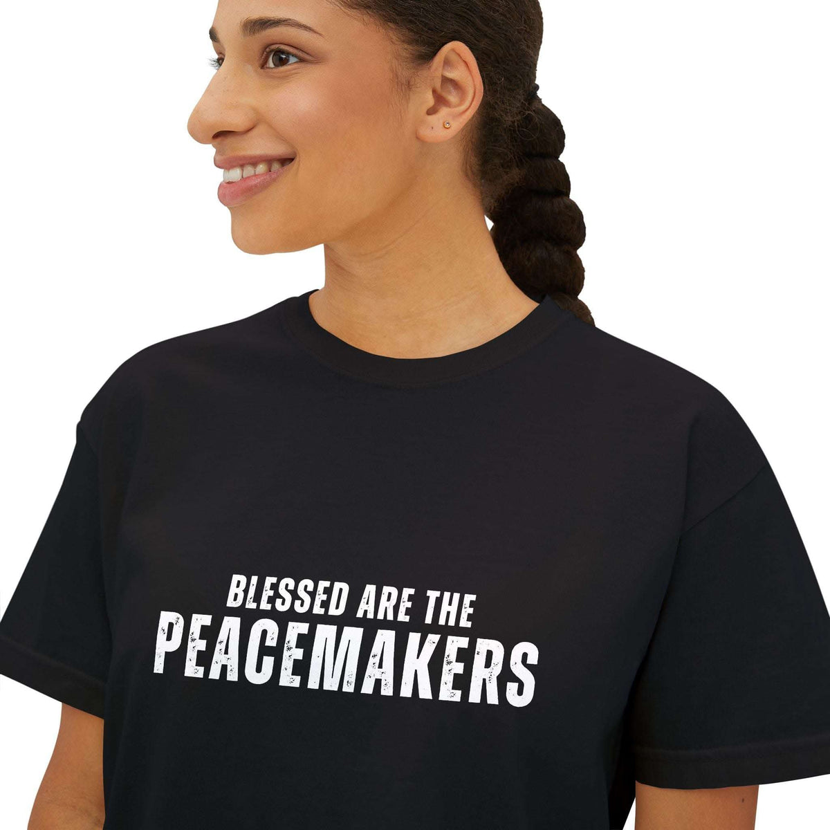 Woman wearing black Tee Blessed be the Peacemakers with white text "Blessed are the Peacemakers" front print