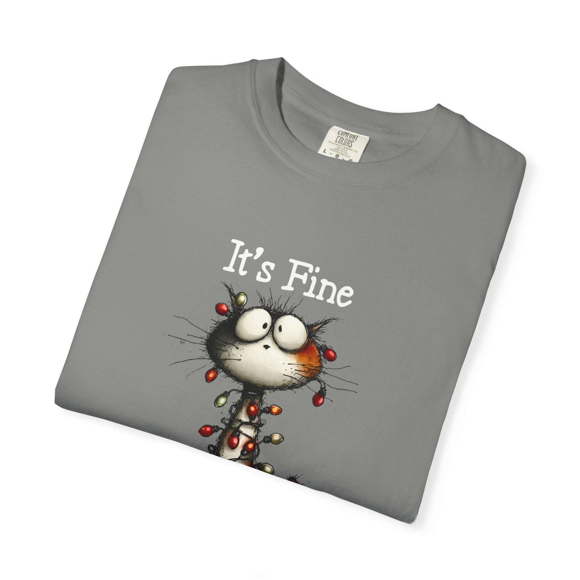 Folded gray t-shirt with a cartoon cat and 'It's Fine' text on a white background