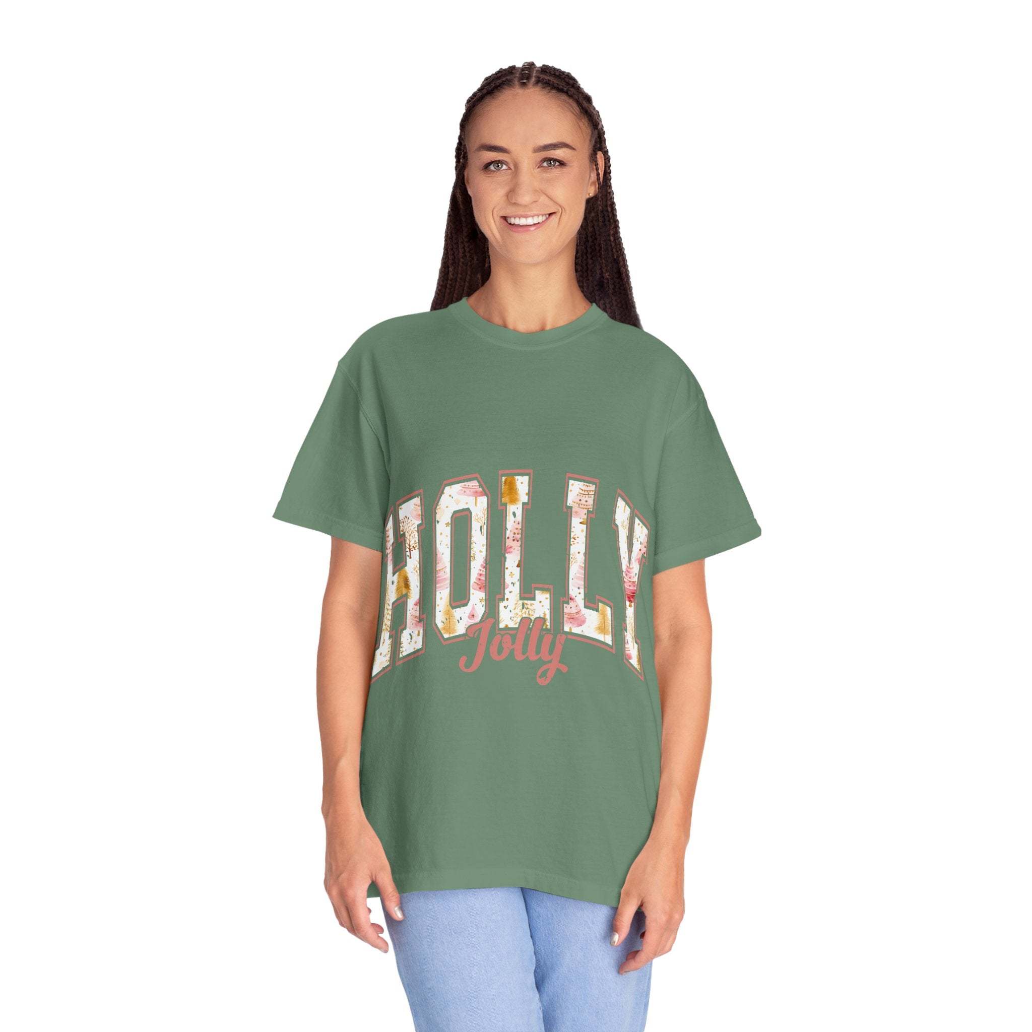 Woman wearing green Varsity Holly Jolly T-shirt with festive text, relaxed fit, and garment-dyed fabric